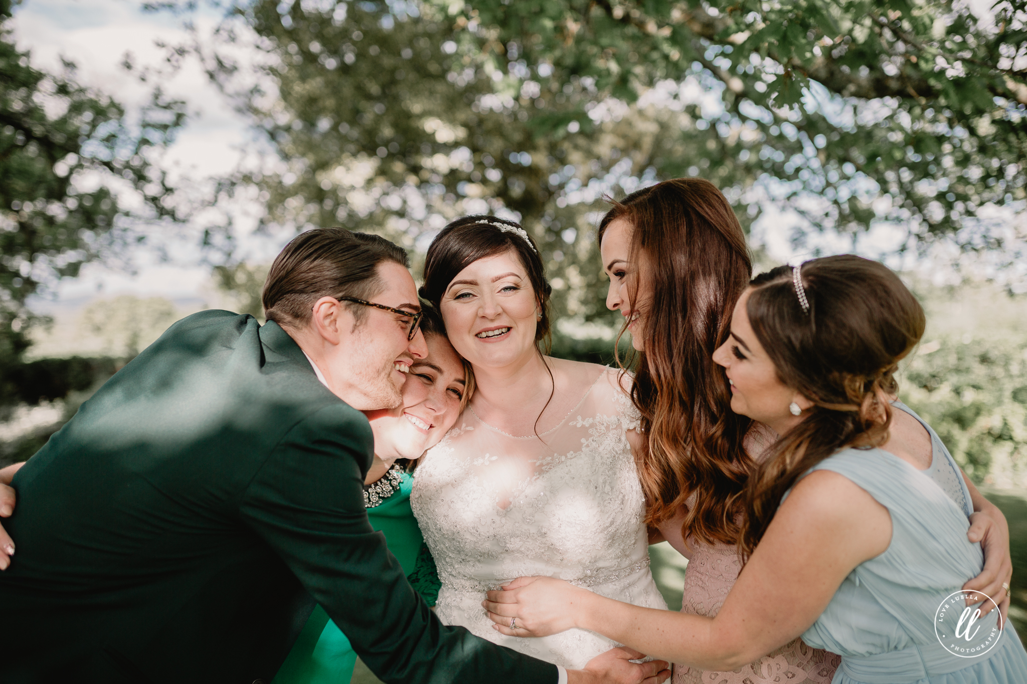 Childhood best friends hugging in the kinmel manor grounds