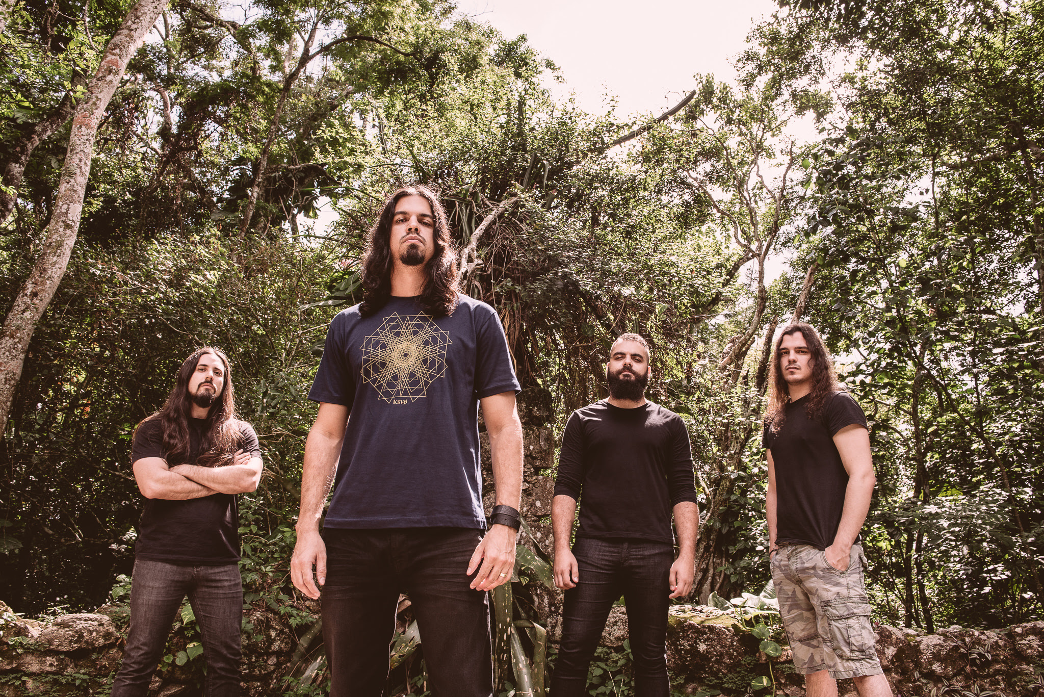 Unleashing a furious and blistering sound bred from the union of varied creative metal borne winds, Brazilian metallers Siriun have persistently drawn eager ears since emerging in 2014 and are poised to do so again with the release of their debut album, 'In Chaos We Trust' . Pre-order the album HERE . Siriun has teamed up with Metal Injection , for an exclusive premiere of their new video for the song "Mass Control" . Watch the video HERE . 'In Chaos We Trust' is a furnace of sonic and emotional fire as ravenous as it is seductive, each track drawing the listener into unique explorations of sound and provocation. It sees acoustic and predatory sides often entangling, exotically melodic and savagely invasive textures frequently aligning as the compelling lyrical and vocal confrontations of Alexandre roar.