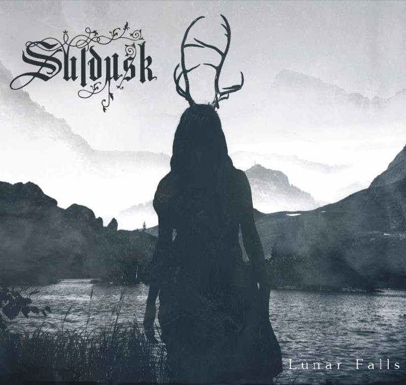 Artwork by Aki Pitkänen, Narikka Photography Hailing from Melbourne, Australia, SULDUSK - a new project led by other-worldly frontwoman Emily Highfield - have released their brand new debut full-length album, entitled Lunar Falls ,today! SULDUSK weaves acoustic tones of dark folk with elements of doom, atmospheric black metal and post rock. In celebration of today's release, SULDUSK have revealed a special live acoustic performance video of their track "Three Rivers". Watch the video, filmed at Bakehouse Studio's DeVille Room in Melbourne, Australia, here: https://youtu.be/ocopnTVk6tQ Emily Highfield says, "I am beyond happy to release my first album Lunar Falls today, and am deeply grateful for the support and feedback leading up to this day. To celebrate, please join my acoustic ensemble and myself on YouTube as we play a version of "Three Rivers" for you, recorded at the incredible DeVille rehearsal space at the Bakehouse Studios." While on YouTube, check out SULDUSK 's latest music video for the track"Aphasia" here: https://youtu.be/0rF53CTmjDs Order Lunar Falls now via Bandcamp . In addition to the digital version, Lunar Falls is also available as a Collector's Edition Digipack-CD (first press, limited to 1000 copies) and LP (limited colored vinyl with poster) via the Northern Silence Productions webshop or Bandcamp page. The black/white half-and-half edition of the vinyl, which is limited to only 99 copies, is only available via the NSP webshop while stock lasts. Lunar Falls ' undercurrent theme is about living on the margins, and the intolerable suffering and sacrifice in the quest for identity. Nature provides much of the lyrical inspiration as the source of refuge and guidance throughout this quest. Lunar Falls is dedicated to the memory of late singer-songwriter Aleah Starbridge ( Trees of Eternity ). With Lunar Falls , Emily Highfield explains that she wants to convey an escape to a soothing and real place. Her organic, earthly approach to music creates an immersive soundscape - a powerful panorama of shimmering guitars, haunting melodies and atmospheric density. SULDUSK first turned heads a few years ago after frontwoman and then-solo artist Emily Highfield uploaded some of her compositions to Soundcloud. When the melancholic black metal-infused acoustic track "Drogue" ended up reaching over 10,000 plays in less than a month, Highfield knew she was onto something great. This inspired Highfield to create the live and current incarnation of SULDUSK - a chamber metal ensemble which has since been embraced by audiences and underground musicians alike. Lunar Falls was engineered, mixed and produced by Mark Kelson, with additional engineering by Jesse Oberin. The album was mastered by Joseph Carra at Crystal Mastering. Lunar Falls track listing: 1. Eleos 2. Solus Ipse 3. The Elm 4. Aphasia 5. Three Rivers 6. Autumnal Resolve 7. Catacombs 8. Nazaré 9. Drogue 10. Sovran Shrines SULDUSK is: Emily Highfield: Vocals, Guitar Mark Kelson: Guitar, Bass, Keys Glenn James: Percussion Marty O'Shea: Drums Nicky Blackmore and Bryan Murphy: Additional Guitar Francesca Mountford: Cello SULDUSK online: www.facebook.com/suldusk www.instagram.com/suldusk suldusk1.bandcamp.com "Emily Highfield, the sole creator of SULDUSK , has succeeded in creating thoroughly entrancing musical experiences through seamless juxtapositions of contrasting musical styles. Even her vocals are representative of those contrasts - both caustic in their acidity and beautifully ethereal in their clarity." - No Clean Singing "Mysterious, hypnotic, compelling songwriting. Haunting and beautiful, very original - gentle, soothing, and then at times unexpectedly powerful when it conjures other-worldly dark screams from the collective sub-conscious - like Mother Nature venting her fury!" - David Hirschfelder, Internationally award-winning soundtrack composer "Varyingly described as acoustic Black Metal, Blackgaze or Doom Folk, SULDUSK have a sound that is entirely their own and utterly captivating... While no comparison can truly capture the magic of SULDUSK , fans of Opeth's 'Damnation' album are likely to be impressed." - Overdrive Magazine