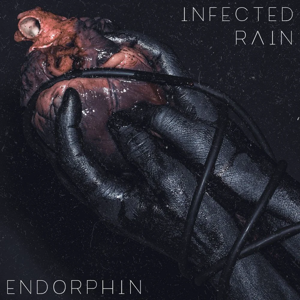 Endorphin tracklisting: 1. The Earth Mantra 2. Black Gold 3. Symphony Of Trust 4. Pendulum 5. Passerby 6. Lure 7. Victims 8. Walking Dead 9. Taphephobia 10. Storm Earlier this summer, the band premiered a single for the highly acclaimed track Lure . Dive into Infected Rain 's massive wall of sounds and listen HERE! An impressive music video for the album opening song, The Earth Mantra , has been released HERE! “ We are extremely happy to present our fourth album “Endorphin”, which is very important to us in many ways,“ Infected Rain continues. “Although it is our fourth album, it is the first one that is being released with Napalm Records and we cannot be grateful enough for their professionalism, support and guidance during the creation of this album. "The result of hard work and many sleepless nights, “Endorphin” has become not only a music album, but a true confession box in which we poured all of our deepest feelings and emotions. The cover of the album, being seemingly dark, reflects our eternal love for music and the stage. The black hands symbolize our band as we present the audience with our heart, with the strongest and sincerest emotions that we convey through our songs. The wire wrapped around the hands and the heart is an almost literal representation of our love for the stage, as we feel connected to it all the time and it plays an indispensable role in our lives. The name of the album, “Endorphin”, emblematizes how we feel about music, our fans and supporters, just like this hormone induces the feeling of happiness in people, we find ourselves truly happy to perform for our audience and we want to share this feeling of euphoria with each and every one of them. We are absolutely grateful to all the people who support us, for their love and constant encouragement is a proof that what we do is worth doing. Unlike many other bands nowadays, we regard our music not as a marketable product, but as a way of doing what we love and sharing it with all the people who are willing to become part of our world. We would never have been able to be where we are, to be who we are without our faithful fans and we are proud to say that we have always been and will always be true to ourselves and to them.” Infected Rain was formed in 2008 and made their first appearance on stage in the same year, performing a concert dedicated to Slayer. Countless shows all over Europe and Russia followed, alongside headlining slots at Europe's big festival names, until they gained the well-deserved attention of leading rock and metal label Napalm Records. Infected Rain have released two EPs, several singles and three critically acclaimed, full-length records to date. Get infected by a band that is far from the overly manufactured metal many of us have grown accustomed to! For More Info Visit: www.infectedrain.com www.facebook.com/infectedrain www.twitter.com/infectedrain www.napalmrecords.com Infected Rain is: Lena – Vocals Vova – Bass Sergey – Guitar Vidick – Guitar Eugene – Drums Infected Rain live: 02.11. IT, Bari - Demode 03.11. IT, Rome - Orion 05.11. IT, Bologna - Estragon 06.11. IT, Milan - Live Club 07.11. CH, Zurich - Komplex 457 08.11. DE, Stuttgart - LKA 09.11. DE, Oberhausen - Turbinenhalle 10.11. BE, Antwerpen - Trix 12.11. UK, Manchester – O2 Ritz 13.11. UK, Glasgow – Garage 14.11. IRL, Dublin - Academy 15.11. UK, Bristol - SWX 16.11. UK, London - O2 Forum Kentish Town 17.11. UK, Nottingham - Rock City 19.11. DE, Frankfurt - Batschkapp 20.11. DE, Hannover - Capitol 21.11. DE, Berlin - Huxleys# 22.11. DE, Leipzig - Felsenkeller 23.11. DE, Munich - Tonhalle 24.11. AT, Dornbirn - Conrad Sohm 26.11. FR, Bordeaux - Le Rocher de Palmer 27.11. ESP, Barcelona - Razzmatazz II 28.11. ESP, Madrid - Mon Live 29.11. FR, Toulouse - Le Bikini 30.11. FR, Rennes - L’Etage 01.12. FR, Paris - Elysée-Montmartre 03.12. DE, Saarbrücken - Garage 04.12. DE, Nürnberg - Hirsch 05.12. SLO, Ljubljana - Kino Siska 06.12. HU, Budapest - Barba Negra 07.12. CZ, Zlin - Hala Euronics 08.12. AT, Vienna - Arena 10.12. PL, Krakow - Klub Kwadrat 11.12. PL, Warsaw - Progresja 12.12. LV, Riga - Melna Piektdiena 13.12. FI, Helsinki - Tavastia 14.12. FI, Tampere - Pakkahuone 15.12. EST, Tallinn - Rock Cafe 17.12. SE, Stockholm - Klubben Fryshuset 18.12. NO, Oslo - Vulkan Arena 19.12. SE, Gothenburg - Trädgarn 20.12. DE, Copenhagen - Amager