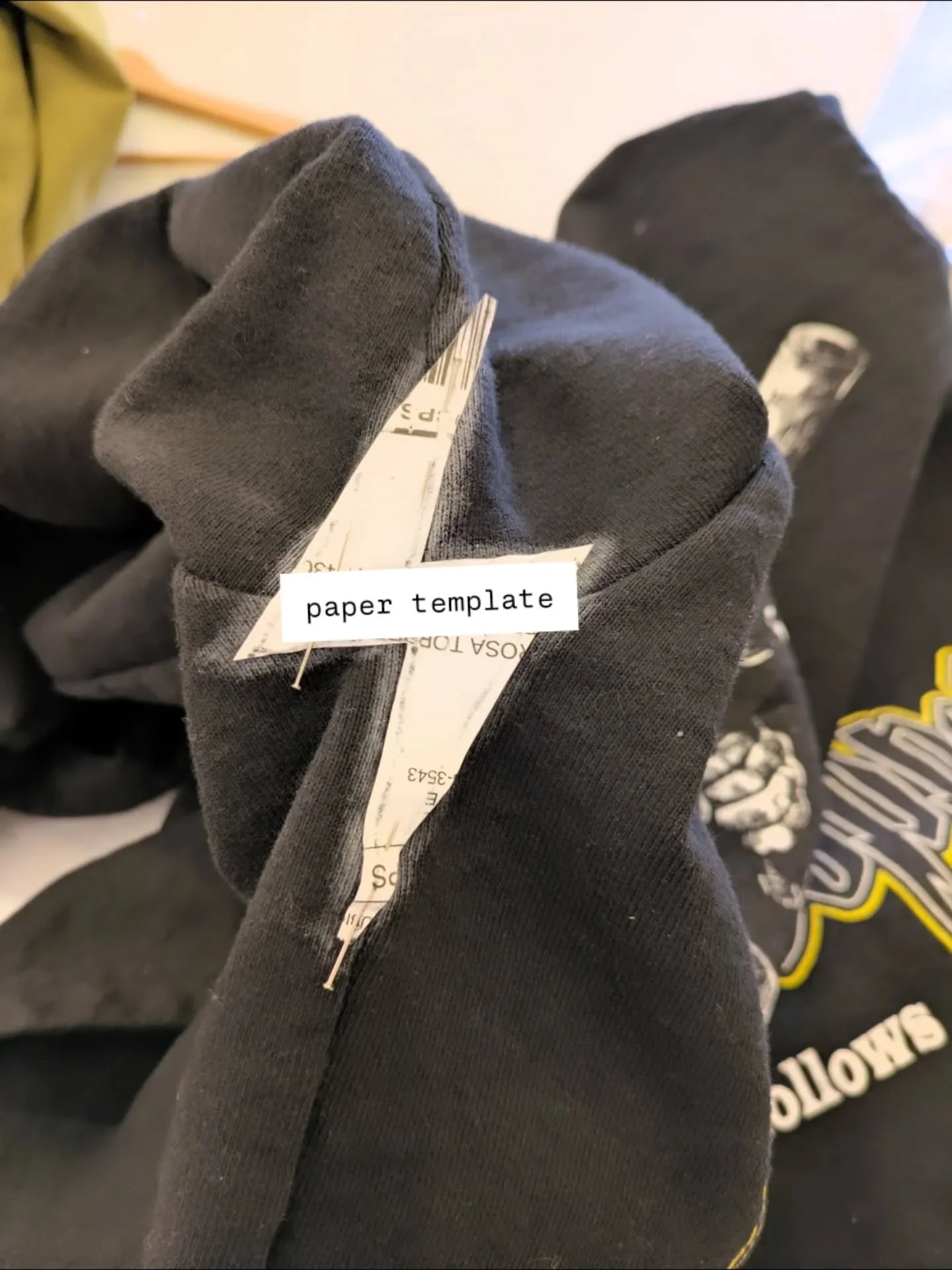 🪡 100 Days of Mending: Day 54: adding fun easter eggs

When Evans came in with this sweatshirt, he was looking for a mend that would stand out to fix the tear in his armhole. Turns out, the only problem was that the seam had split&ndash;so it would 