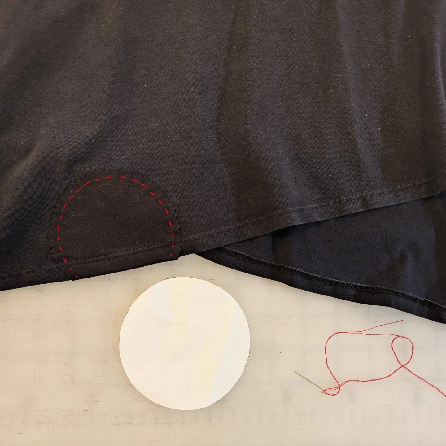 🪡 100 Days of Mending: Day 55: covering a bleach spot with a polka dot ⚫

When a black fabric marker failed, Darlene wanted to cover this bleach spot with a polka dot. She always wears a black leather crown with red stitching by @kristinmariani, so 