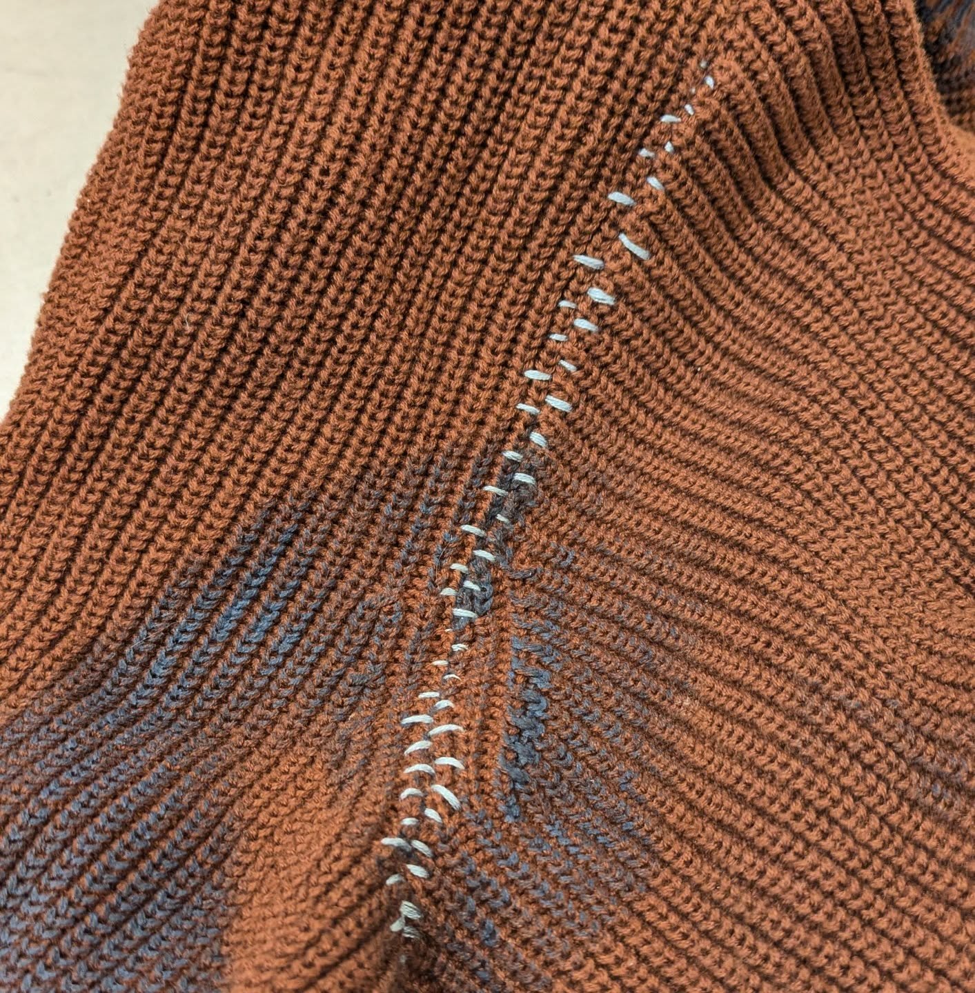 🪡 100 Days of Mending: Day 83: visible mending a split armhole in Marty's sweater

The base of this repair was actually an invisible mend (stitching up the split from the inside), but Marty wanted the mend to &ldquo;pop&rdquo;. So I borrowed the blu