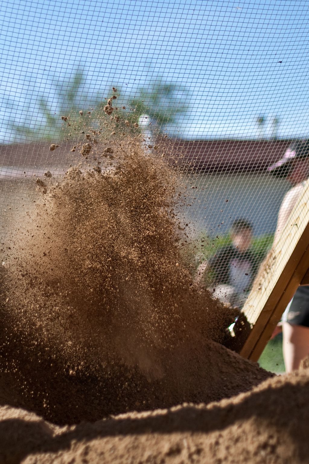 Sifting local soil for an owner builder project.