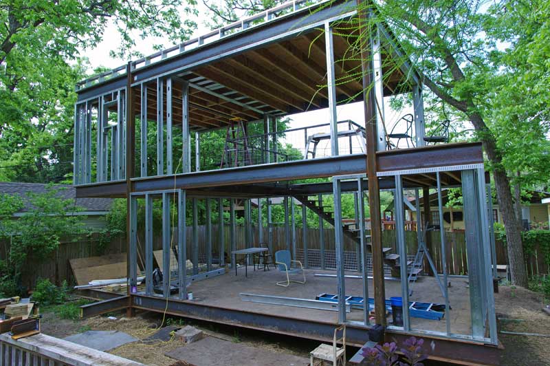 Infill framing. Large 12' x 8' entry to the lower studio will bring in lots of light and tie the 'dirty' studio with the wrap-around deck.