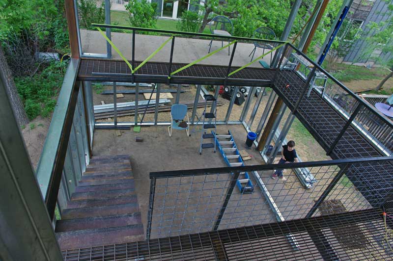 View from the entry of the clean studio. Catwalk wraps around to an outside deck. Juliet for scale.