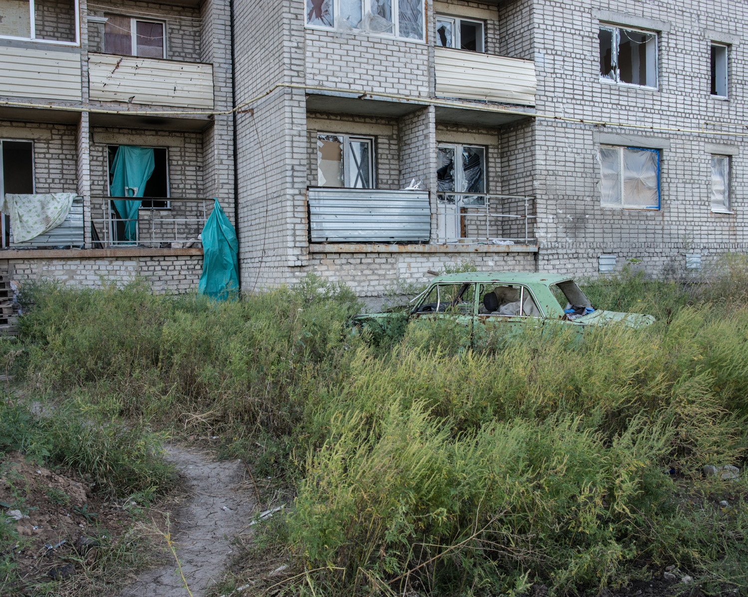  An apartment building in the town of Avdiivka. In mid-2014 Avdiivka was badly damaged when seized by separatists; it was subsequently reclaimed by Ukrainian forces. 