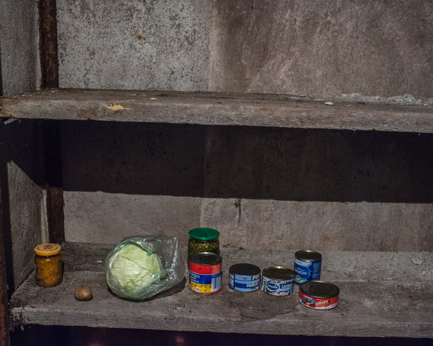  A bare cupboard in the village of Gnutove. Food prices have skyrocketed and deliveries to stores near the front line have grown less frequent. Increasingly, people must rely on food they've stored or are able to grow themselves. 
