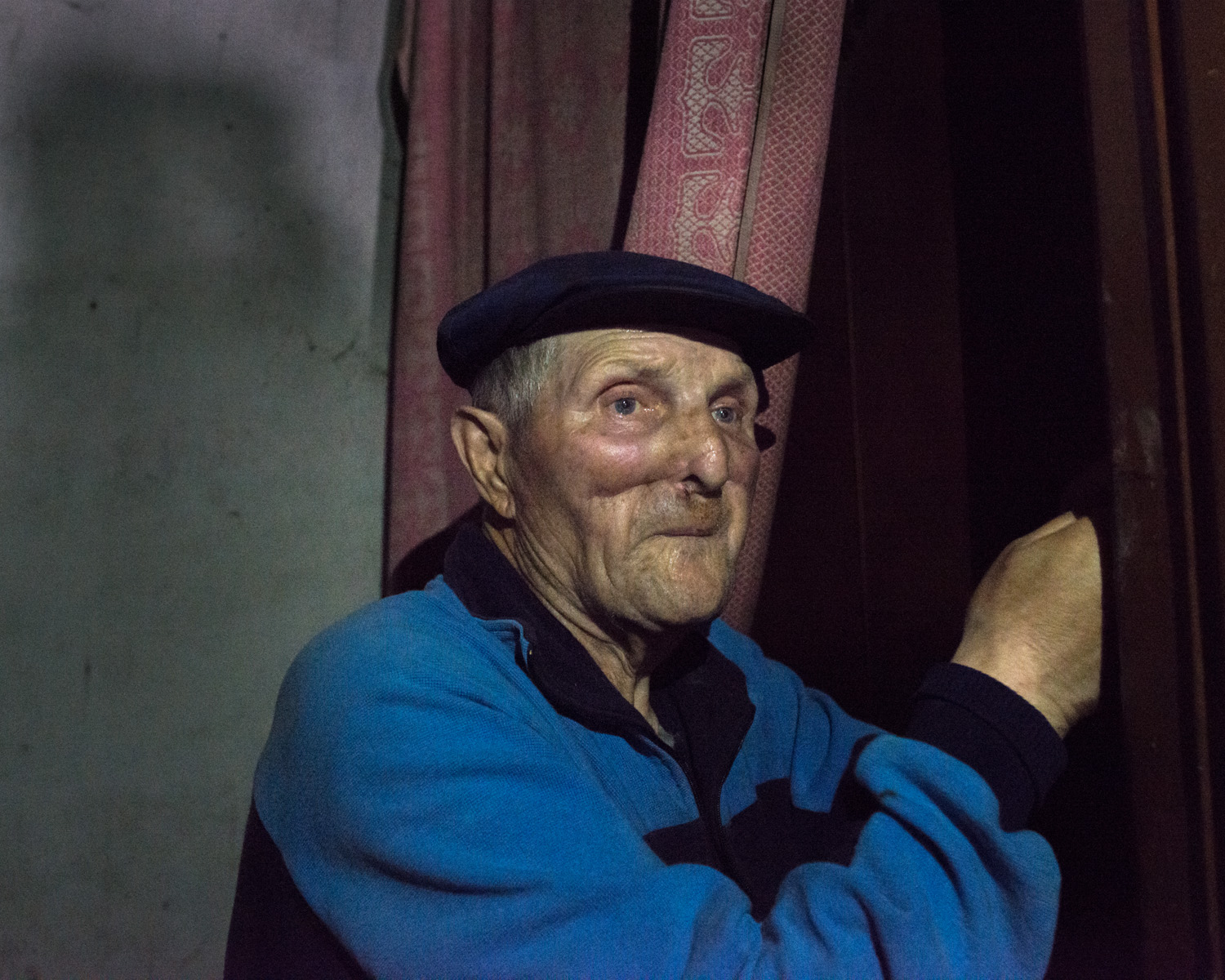 "I was outside when a rocket landed. A piece of shrapnel tore off the front of my face. I was taken to the hospital in Krasnoarmisk and they sewed it back on, I eat through a tube now. I was in the hospital for a month and while I was there thieves broke into my apartment and took everything. Medicine is very expensive and my pension is very small. My pension was larger but it was cut. I go to beg for food from the soldiers every day. It would be better if the shell had killed me because this is not life." -Alexander, 80, Avdiivka.