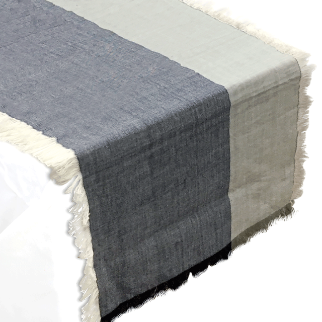 Whether in gradients that evoke the ocean like this navy and mist runner ($44, Pehr) or in more structural design like blue swirl lamp bases, waves swept 2016 with a refreshing air of movement and tranquility.