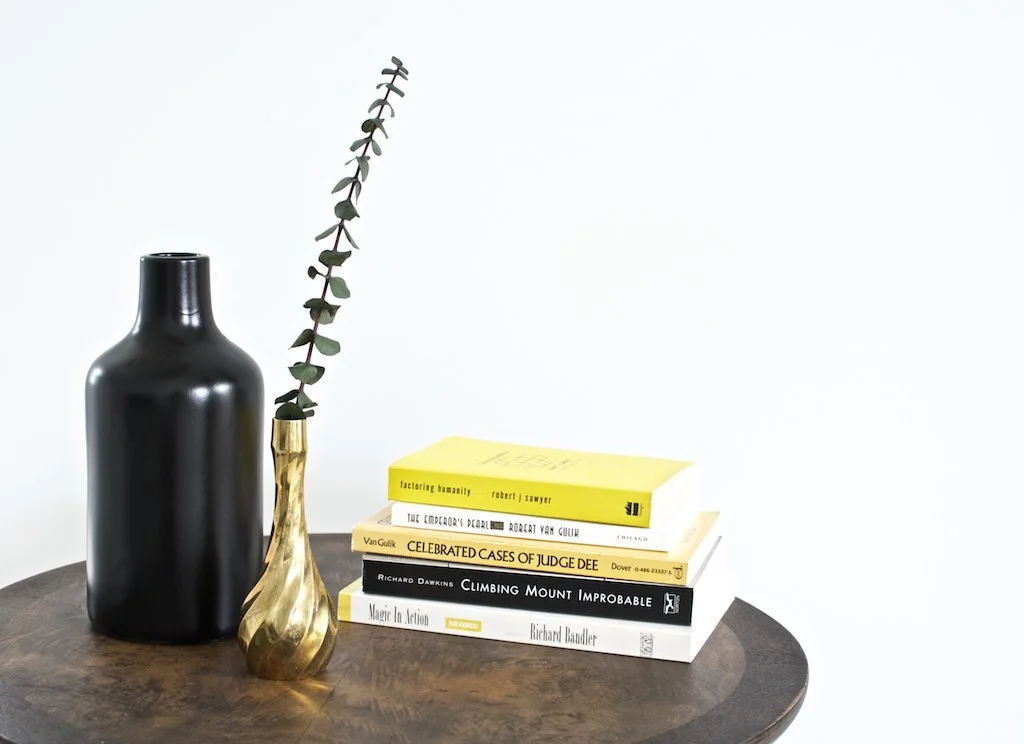 tall vase was painted black to highlight the brass. black vase under $5.