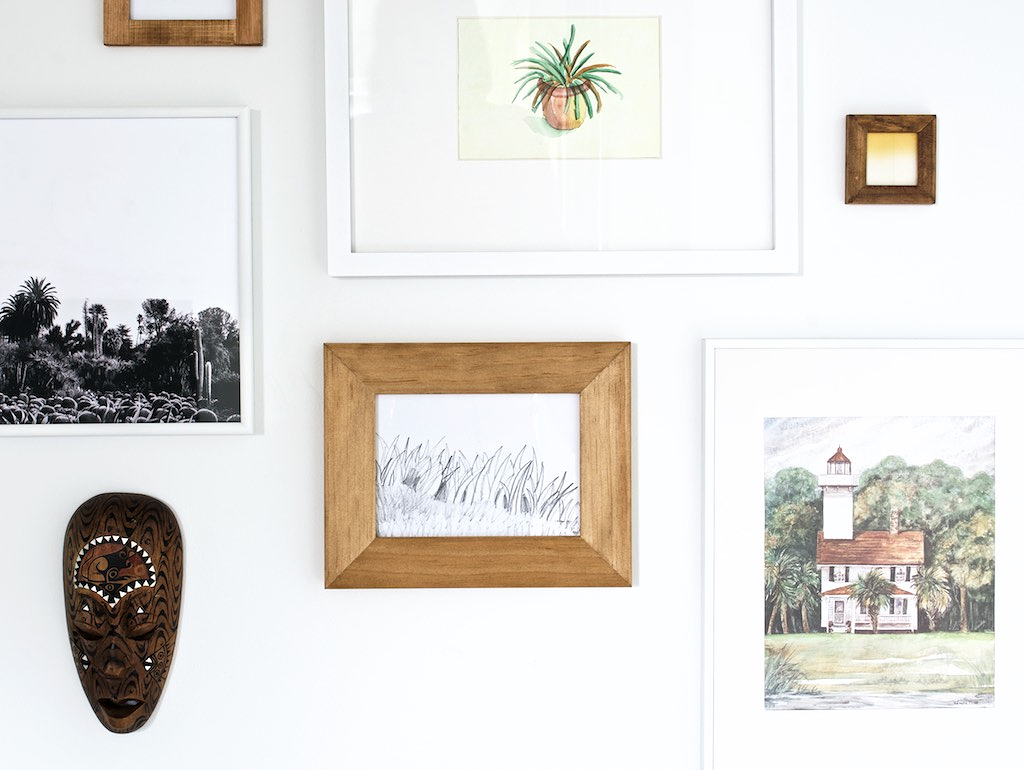 wall art: black and white print from @ sycamorestreetpress print with the house was a great thrift store find (featured in an older post) The mask was another great thrift store find for $3