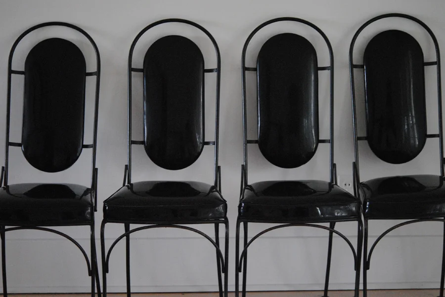 Mid century black iron and vinyl dining chairs
