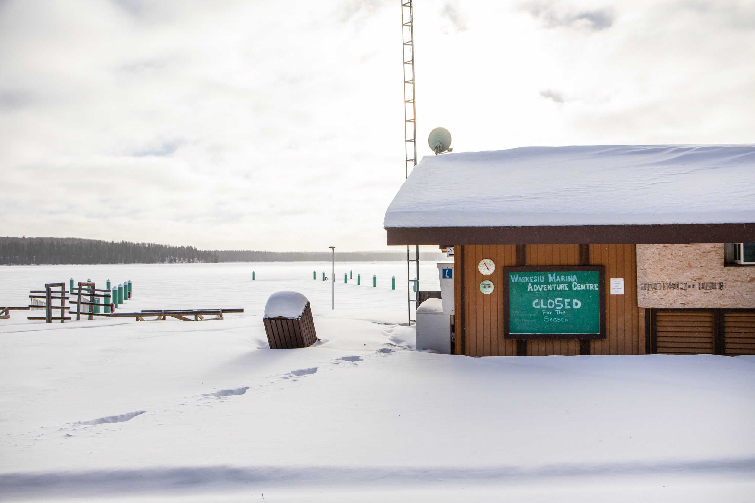 A deserted and snow covered store at the marina Waskesiu Lake