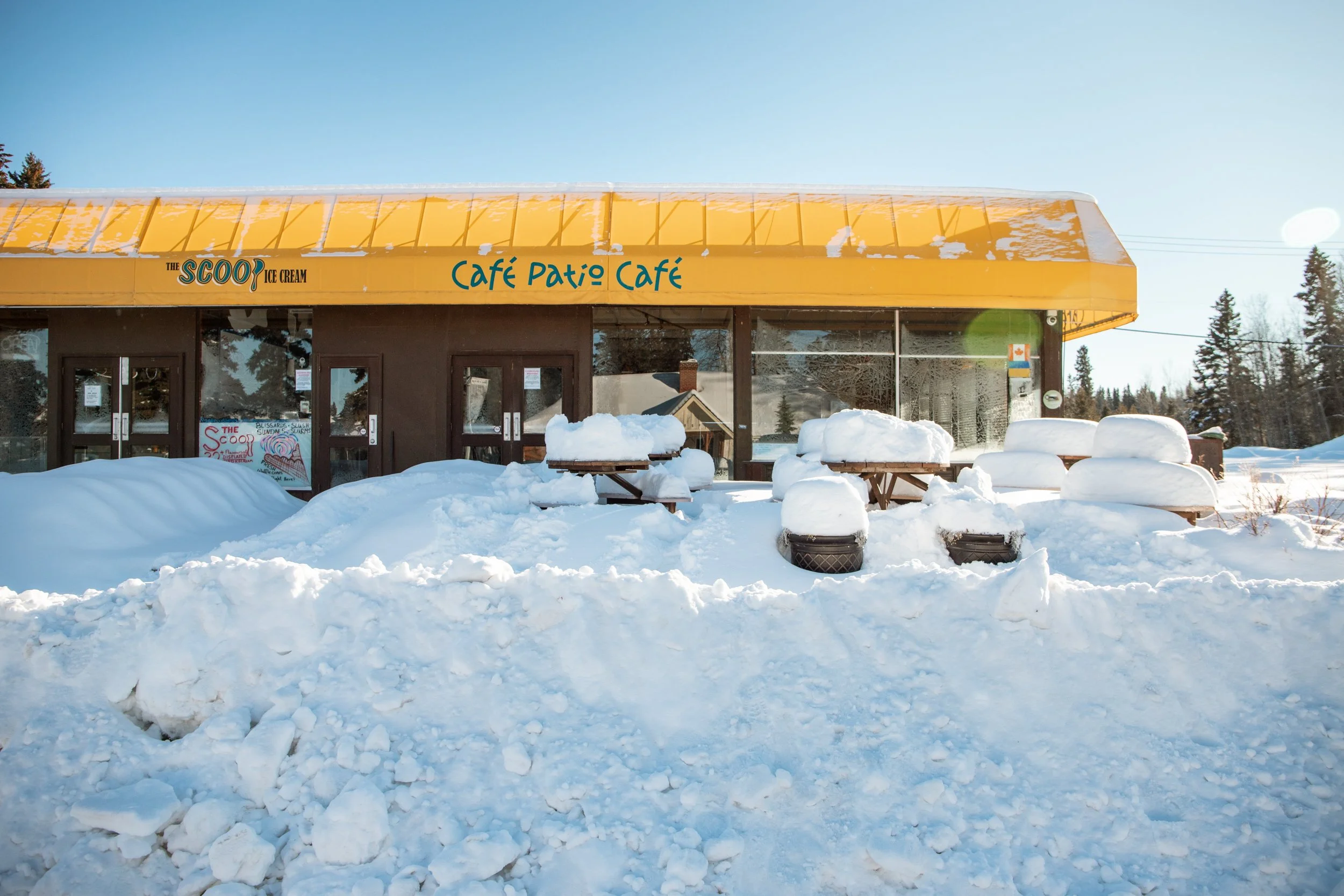 A snow covered patio at the patio cafe