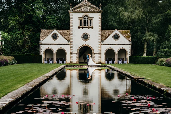A wedding at the classical Pin Mill on the Canal Terrace, Bodnant Garden, Conwy, North Wales.