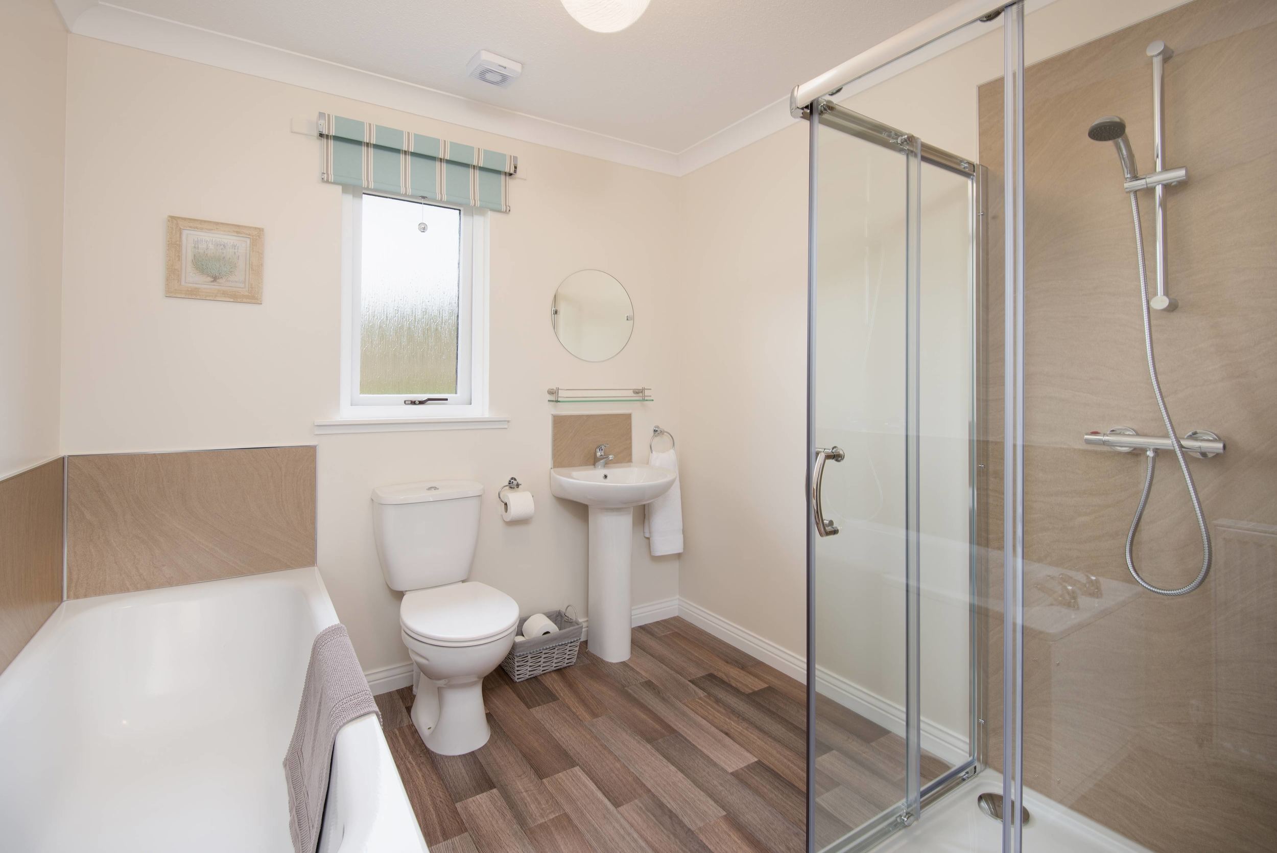 The bathroom is large, modern and provides a separate bath and shower