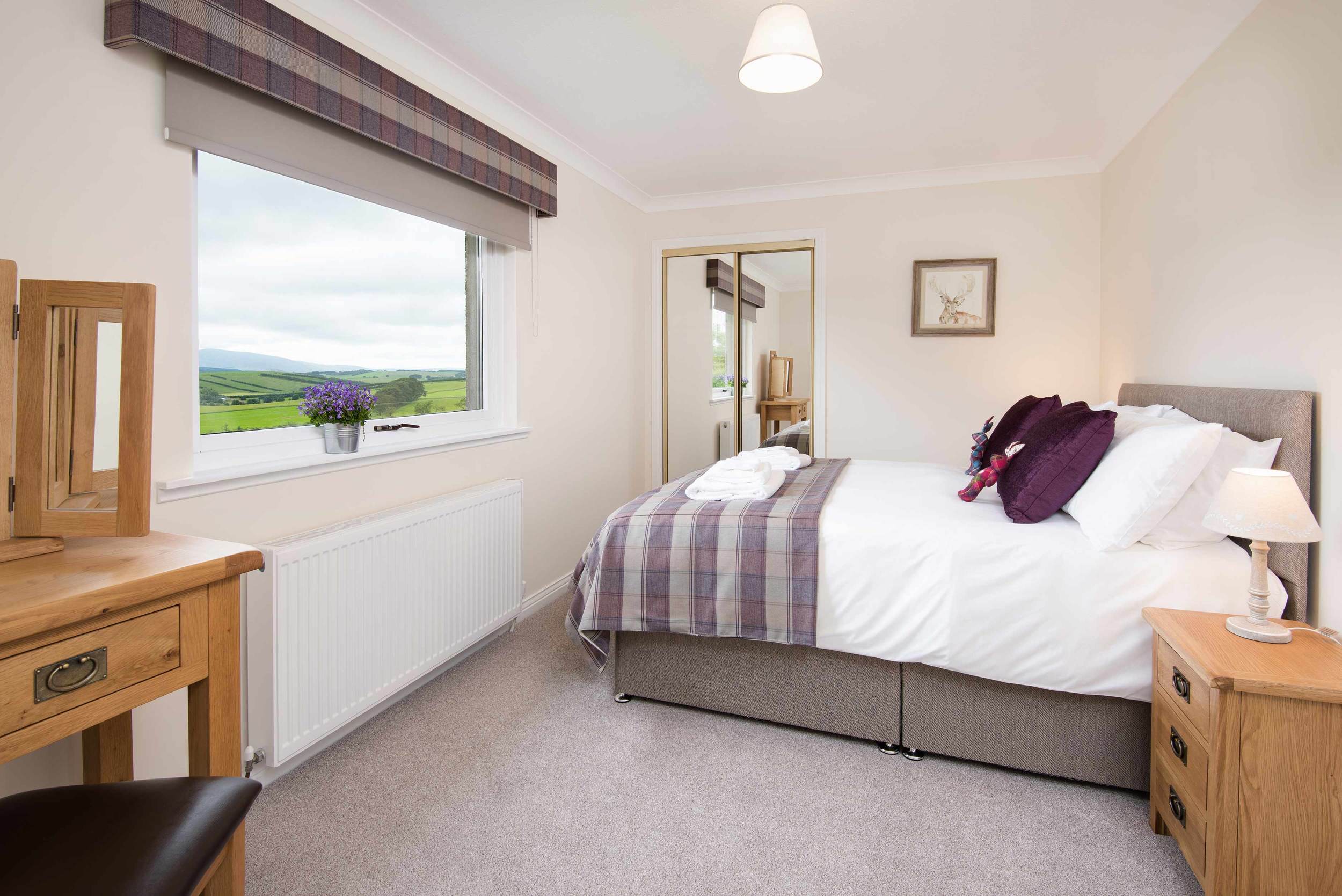 Comfortably sleeping four people, the cottage features a large double bedroom with a king size bed and a twin bedroom. A full size fold up bed is available for use in the double bedroom when required.