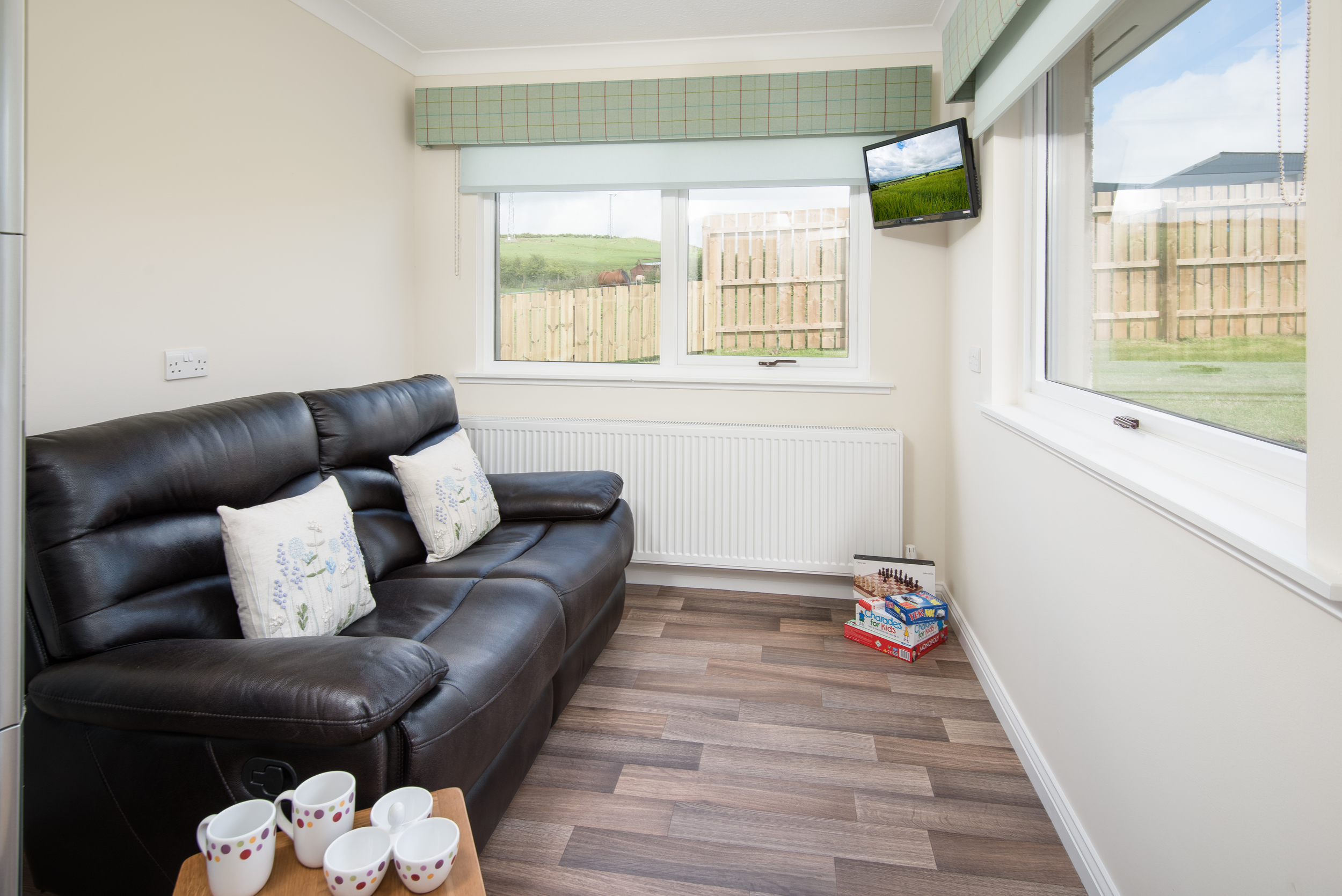 Adjacent to the kitchen is a lovely, bright room with additional seating where you can relax, read or watch films on the wall mounted TV with DVD/CD player. A Wii has also been provided for your enjoyment.