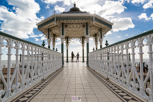 lgbt couple on brighton bandstand