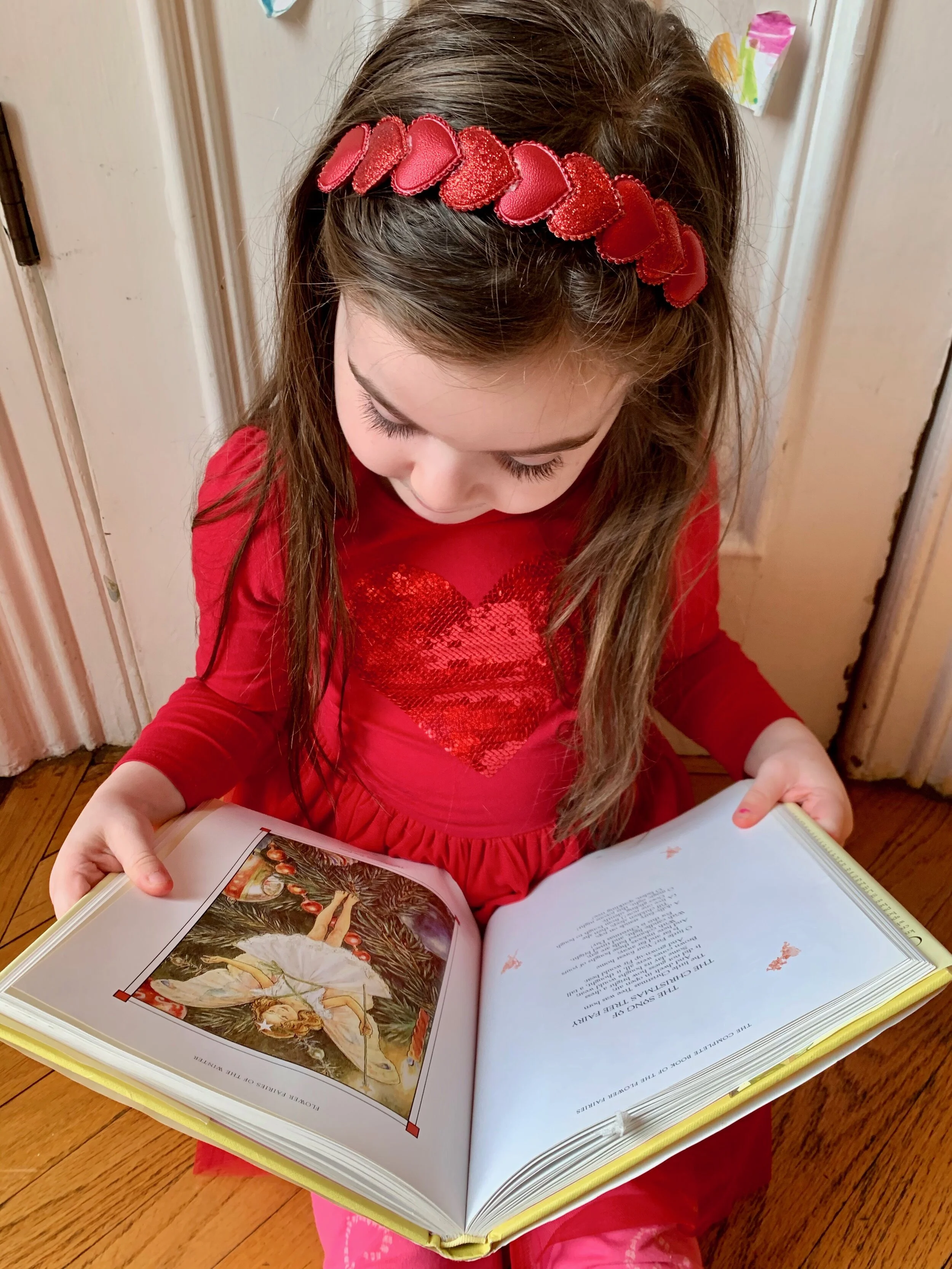 Ramona reads “The Song of the Christmas Tree Fairty,” one of the winter fairies featured in Cicely Mary Barker’s Complete Book of the Flower Fairies.