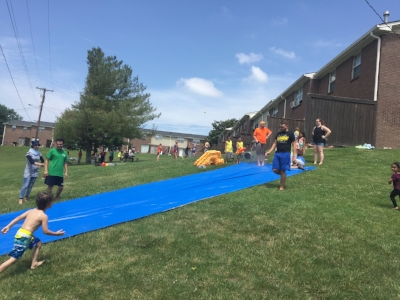 A service team is helping us connect to a local apartment complex by hosting an outreach event. 