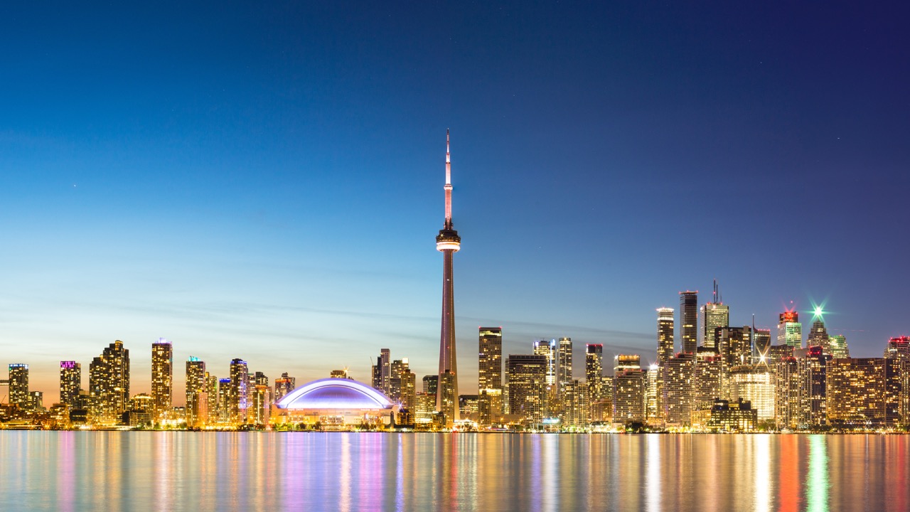 CN TOWER STANDS OUT IN THE TORONTO SKYLINE Photo Credit: licenced through shutterstock.com