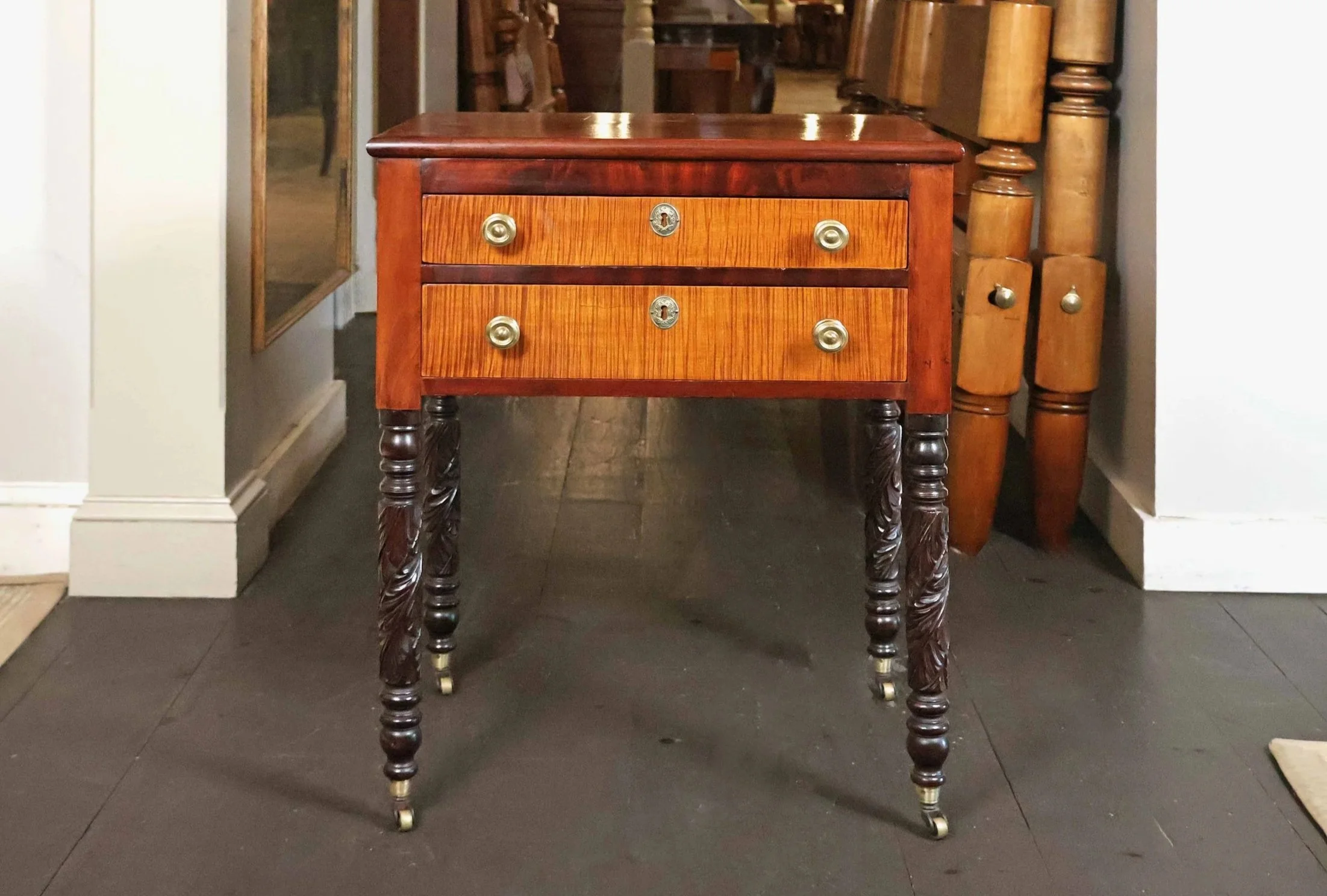 Empire 2 Drawer Stand in Mahogany with Tiger Maple Drawer Fronts, Carved Legs on Casters, Circa 1830</p> SKU: LA-1025<p> </p><p>
