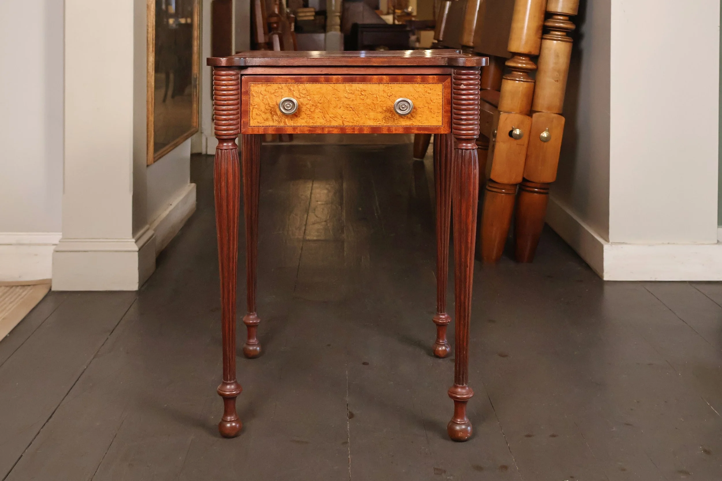 Sheraton One Drawer Stand with Cookie Corners, Delicate Reeded Legs, Mahogany with Banded Birdseye Maple Drawer Front, Circa 1820</p> SKU: LA-975<p> </p><p>