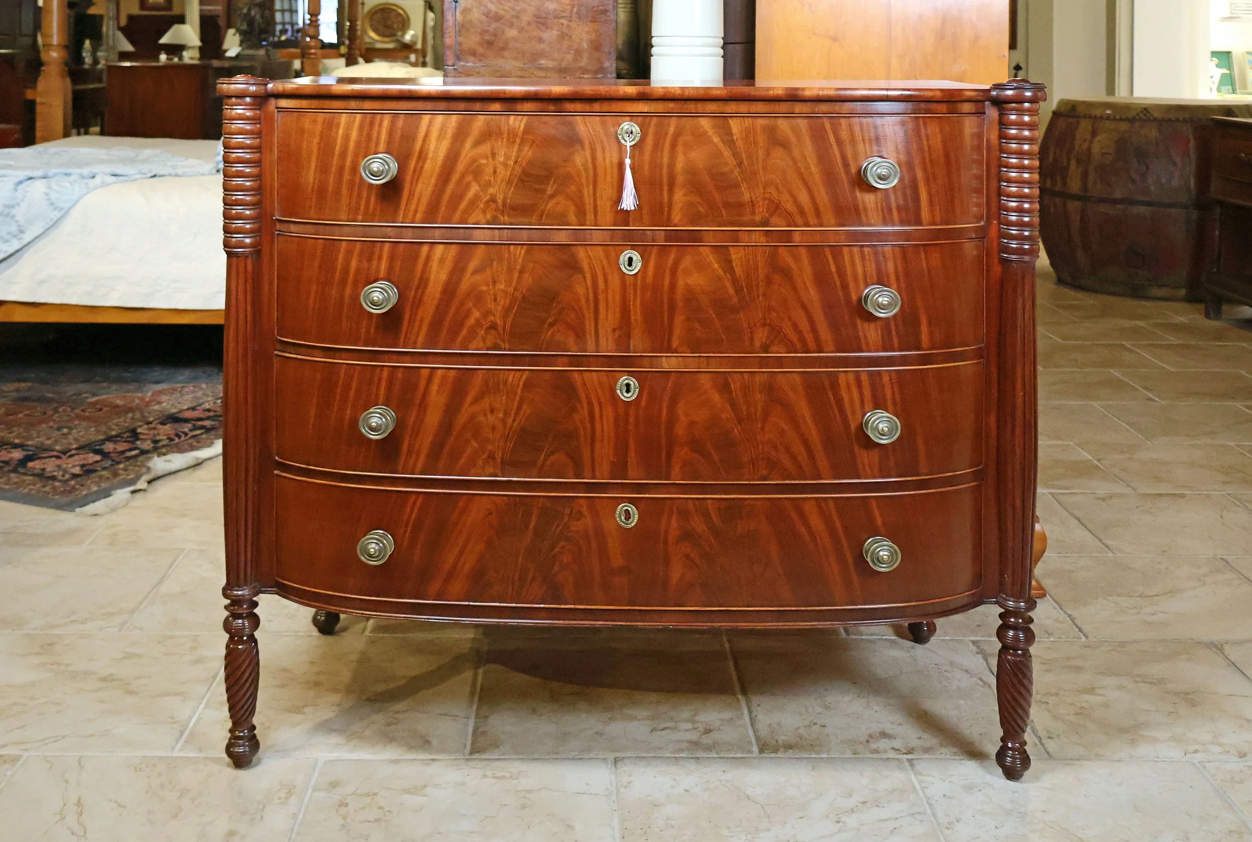 Sheraton 4 Drawer Bow Front Chest in Mahogany, Cookie Corners over Ring, Reeded & Rope Carved Legs, Unusual Ribbed Side Detail, American ~ Circa 1820</p> SKU: LA-932<p> </p><p>