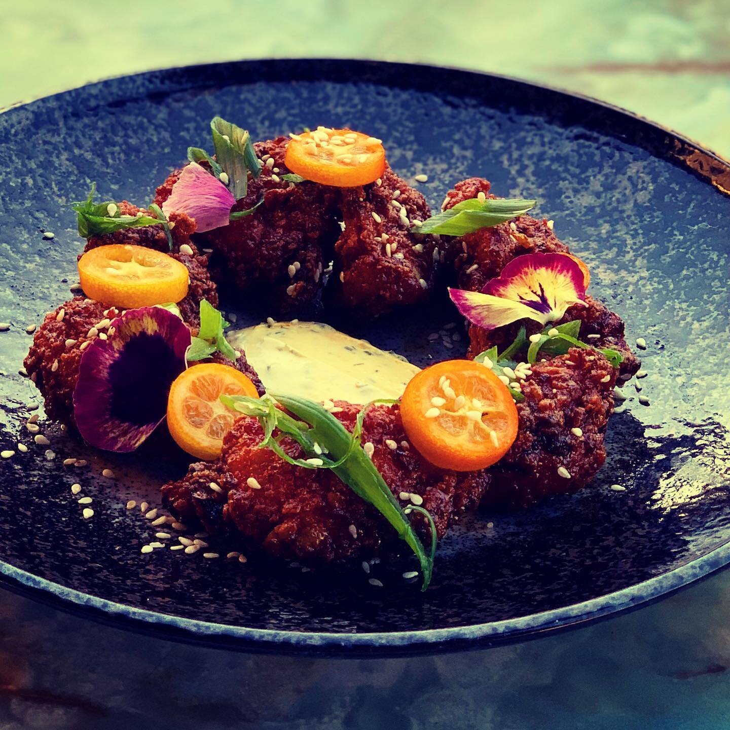 More beautiful things for your feed and your mouth from @bdrohadaflipphone, this is our take on boneless wings. Fried chicken thighs tossed in burnt orange and chili, sesame, preserved kumquat ranch, and scallions. You know you want some. 🍗🍊🔥#eatl