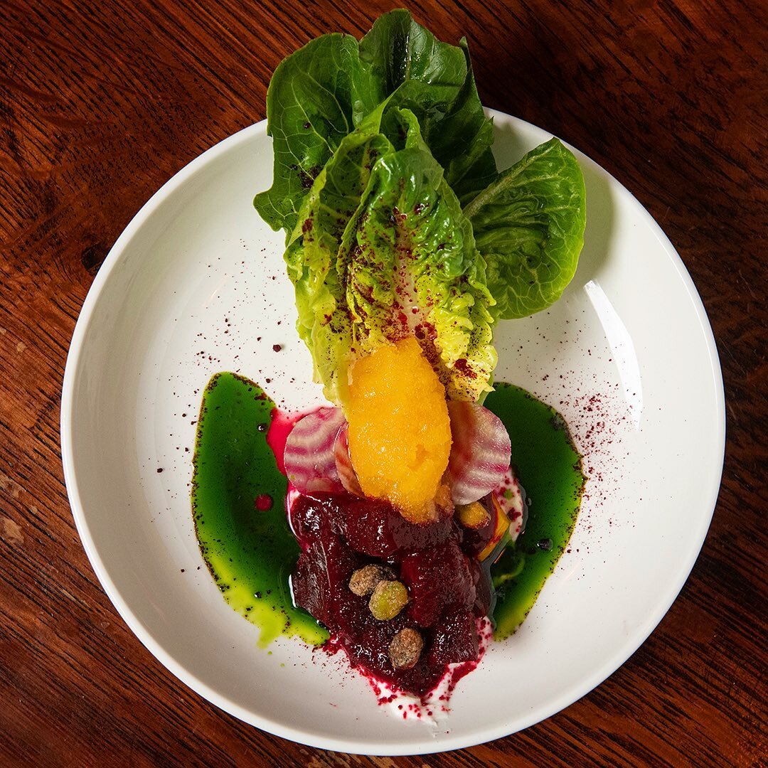 More edible art from the kitchen and @bdrohadaflipphone , this is our beet salad. Three types of beets, little gems, goat cheese, candied pistachio, orange granita, and nasturtium oil. As beautiful to eat as it is to look at! 📸 by @instapizzle #food