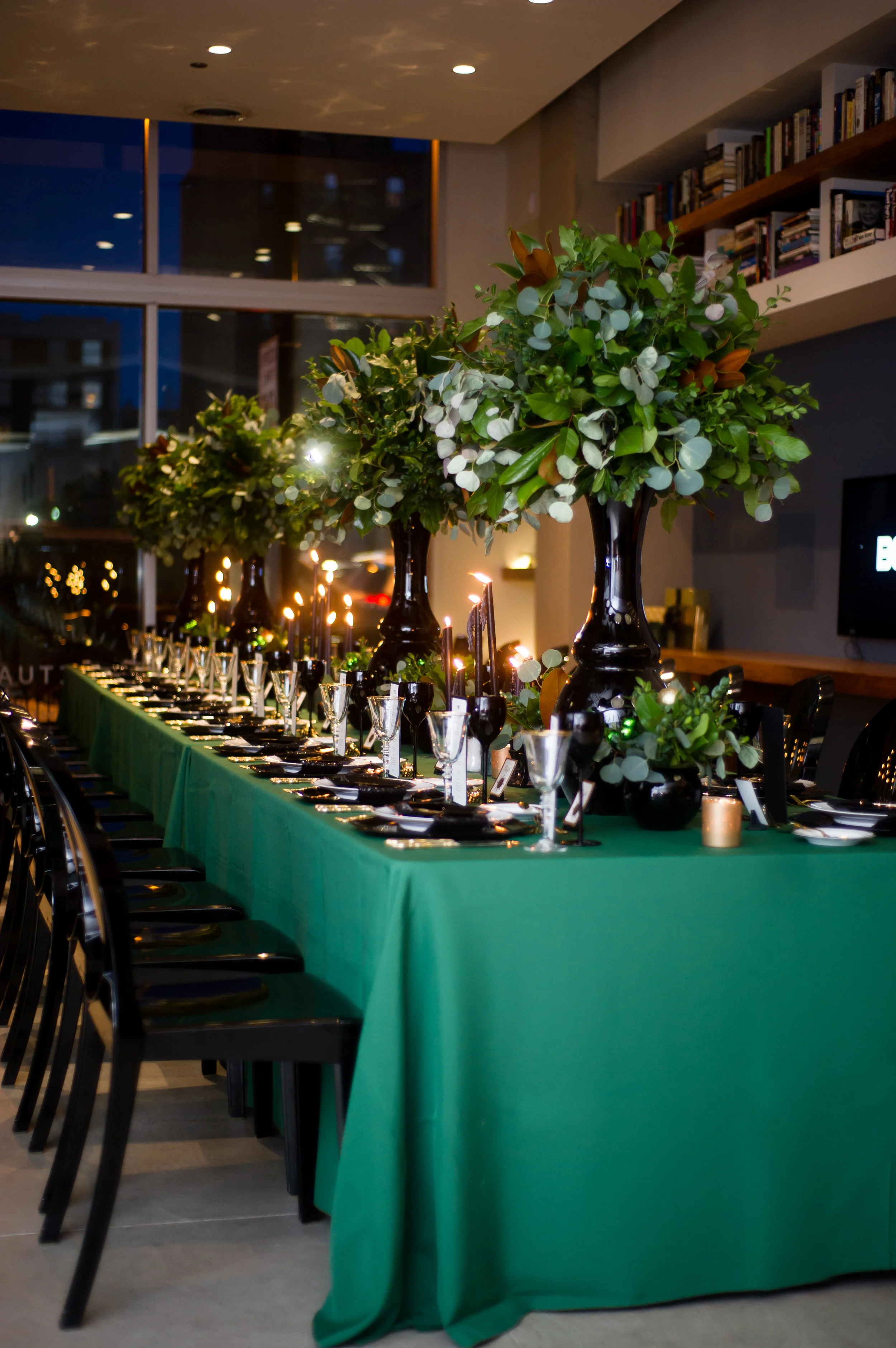   Candlelit event space with concrete ceiling.  