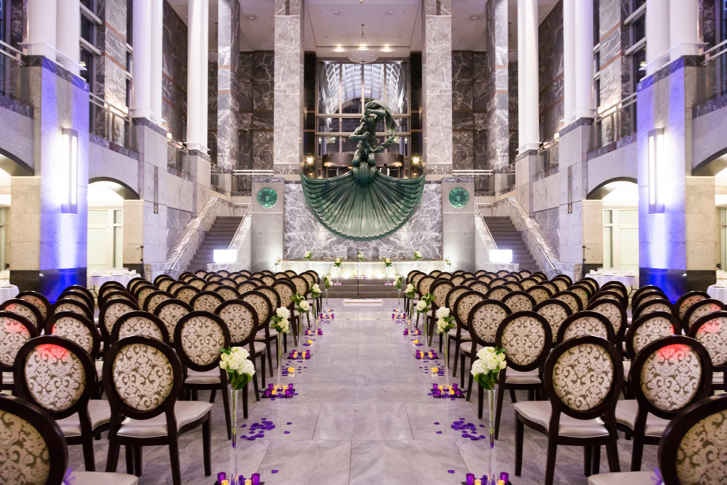   Mezzanine at night with glass ceiling several stories high.  