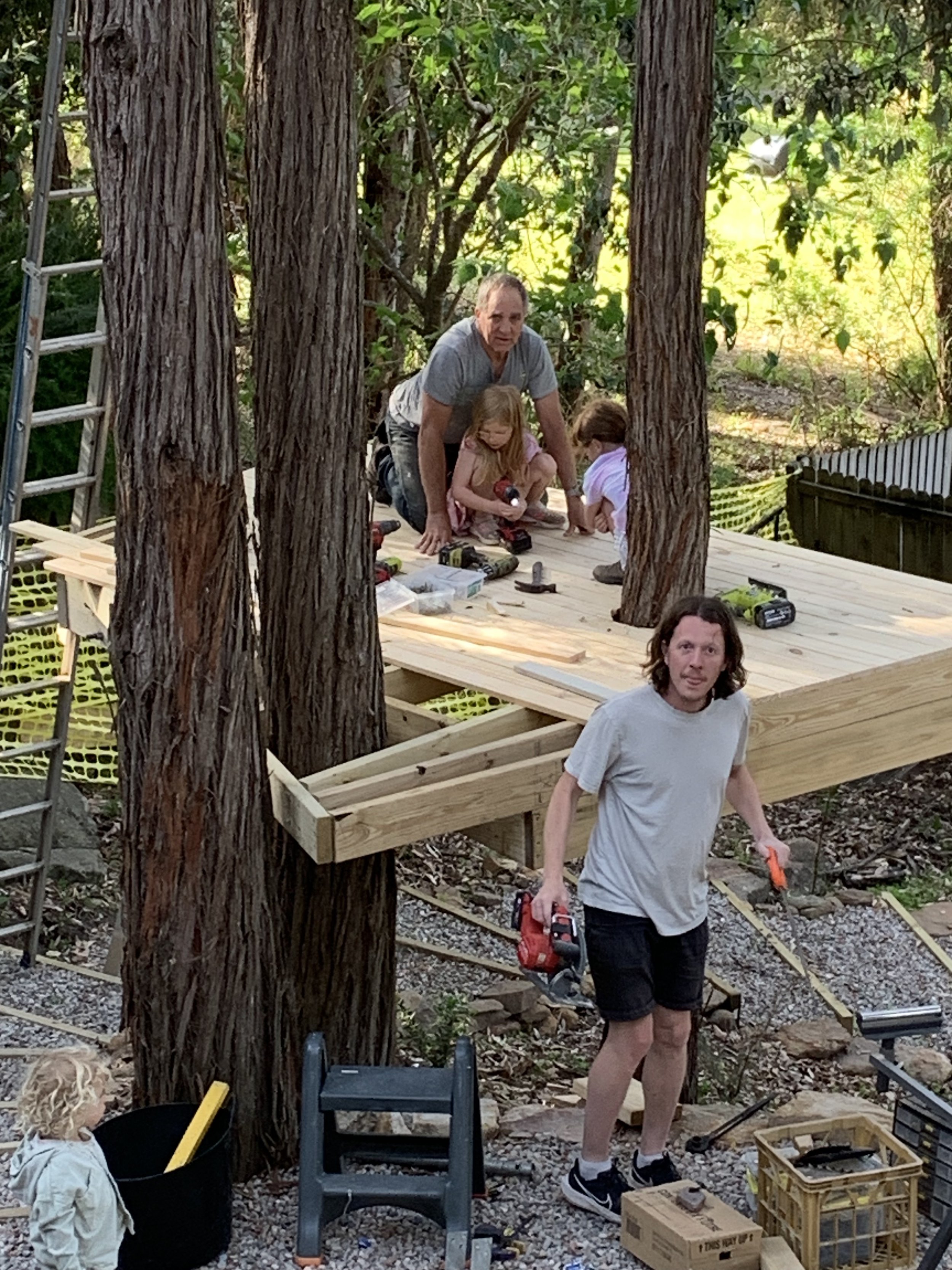 treehouse build grandfather and son and grandkids.jpg
