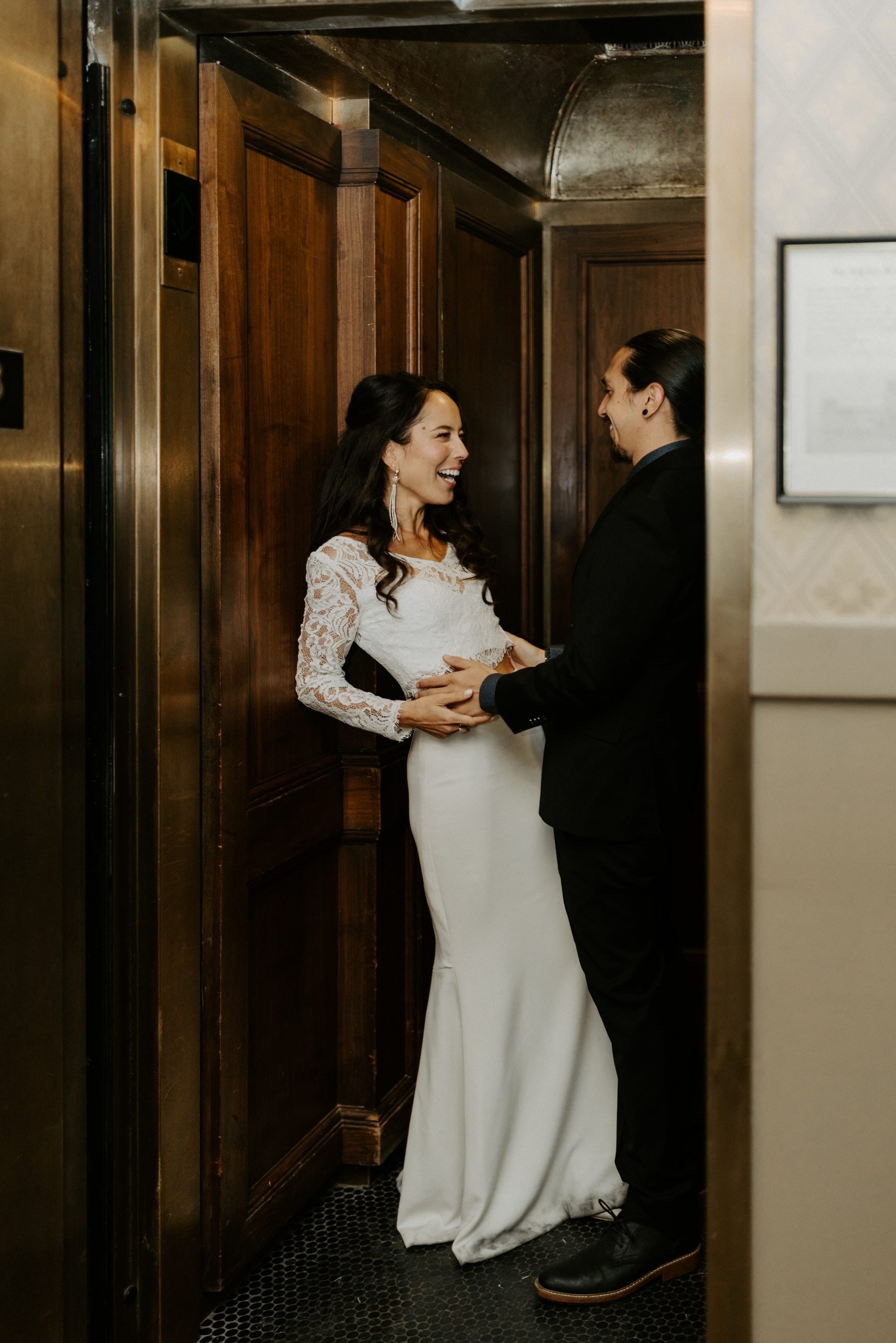 bride and groom in elevator