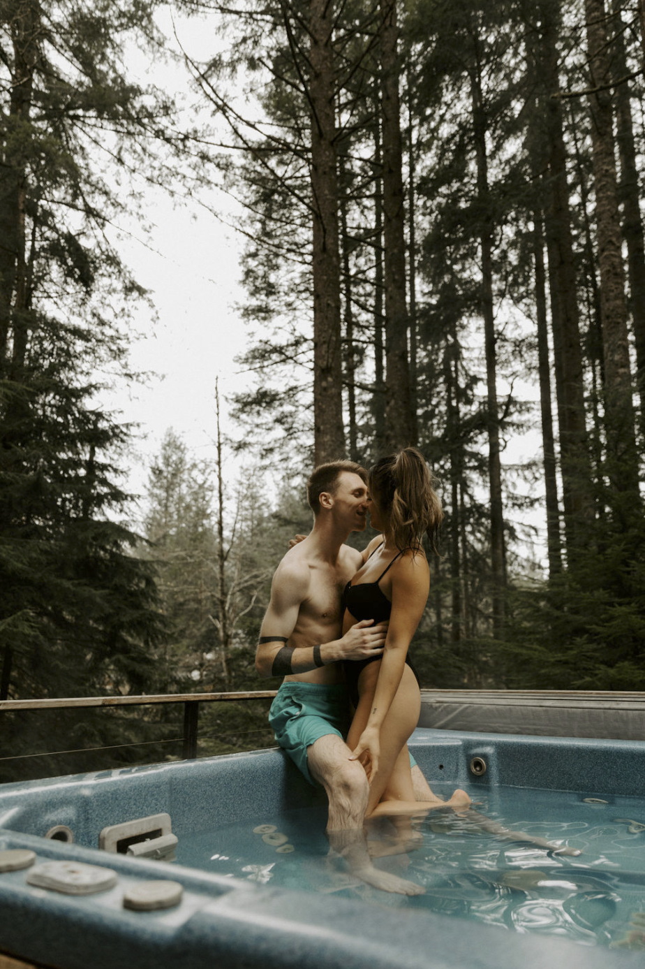 couple snuggling in hot tub
