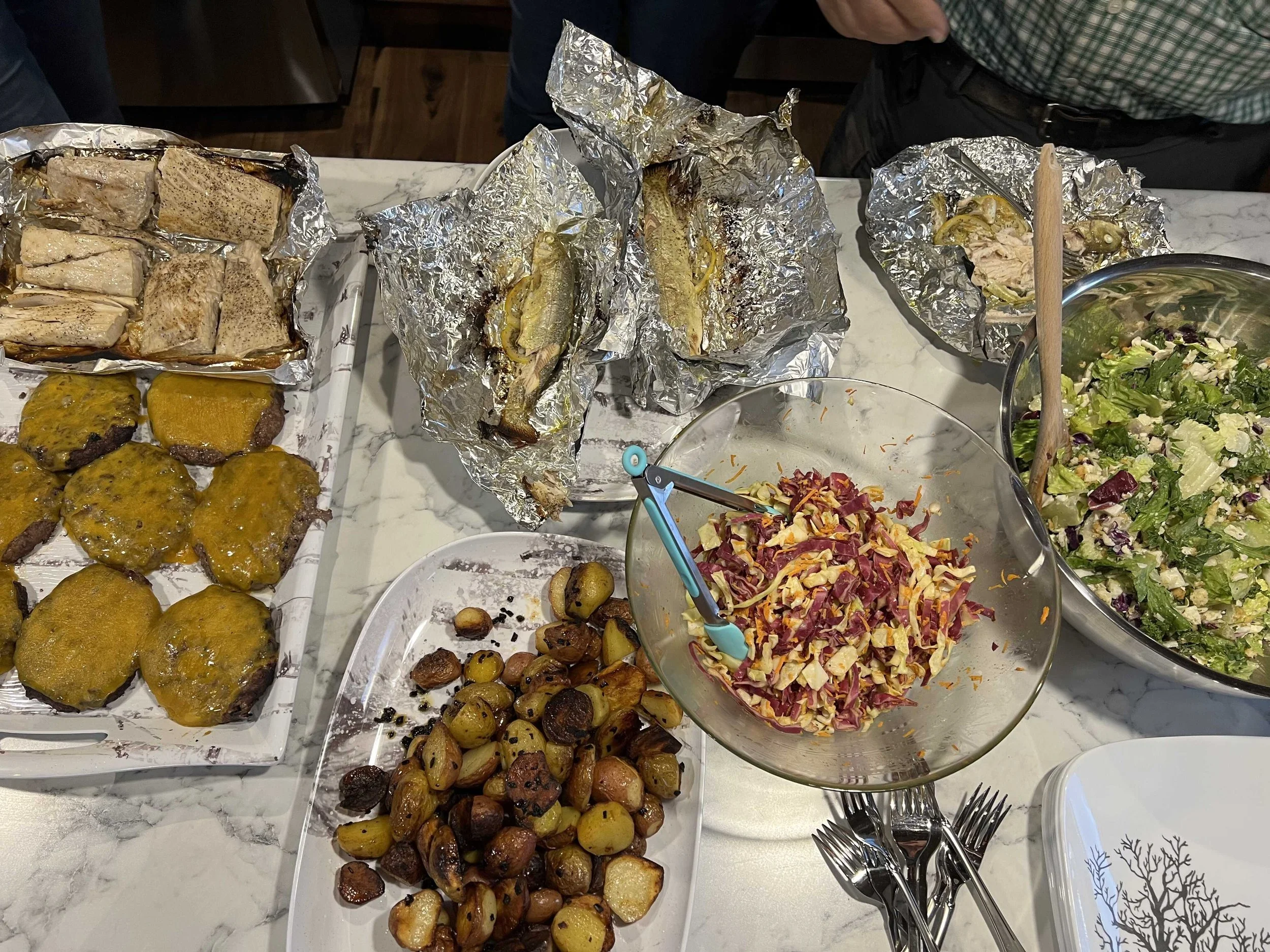  dinner included tilapia, cheeseburgers, salads, potatoes, and freshly caught trout courtesy of Rick’s fishing prowess 