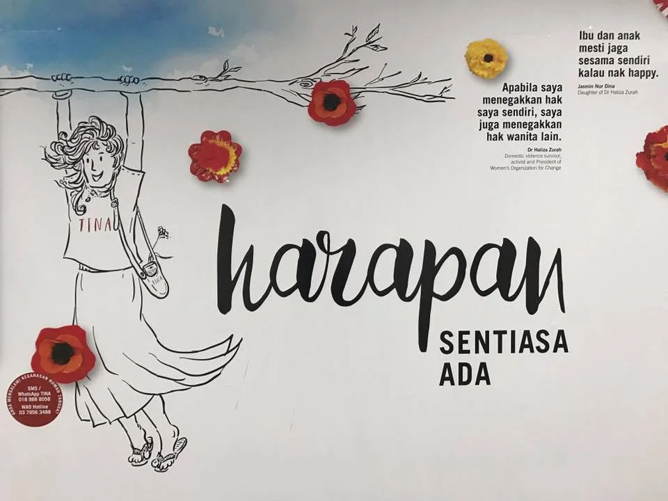 One of six drawings of 'Tina', who is also the namesake of the WAO's domestic violence SMS/WhatsApp line, TINA ('Think I Need Aid'), on the mural in the Masjid Jamek LRT station underground pedestrian tunnel.
