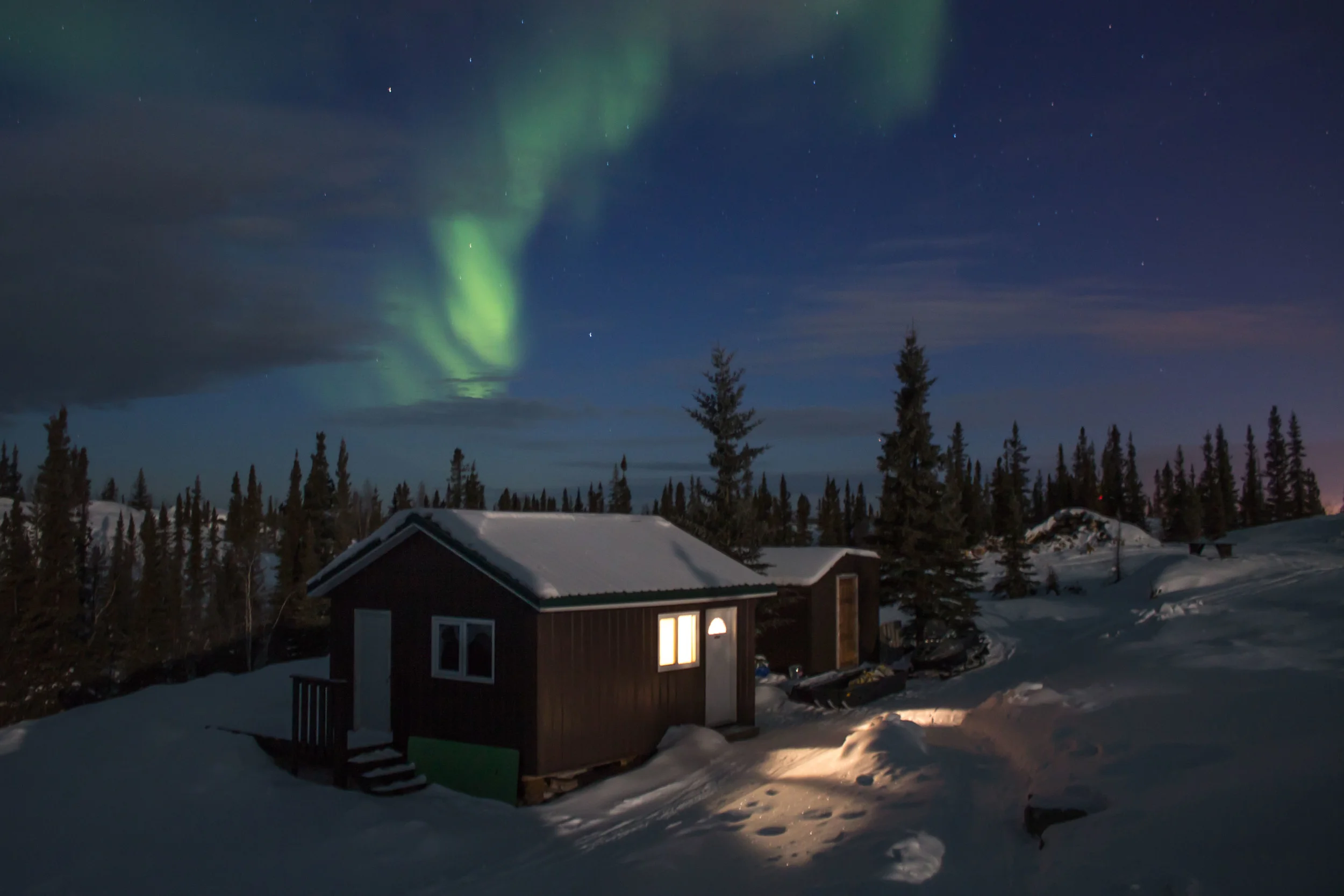 The aurora over another cluster of cottages. Photo by Sara Statham.