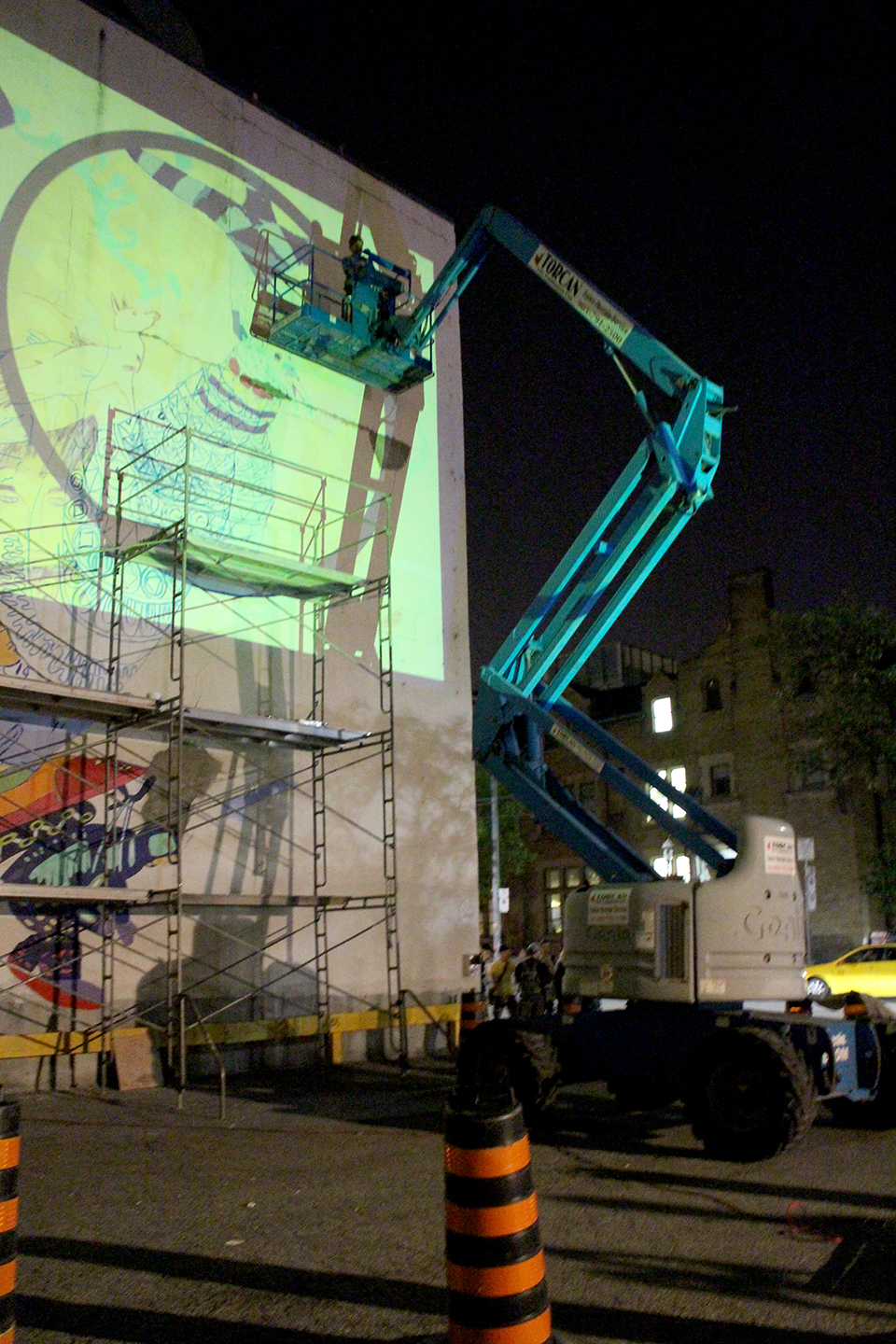 The mural was projected on the wall at night so that the artists could see and trace the outlines. Photo by Alexa Hatanaka.
