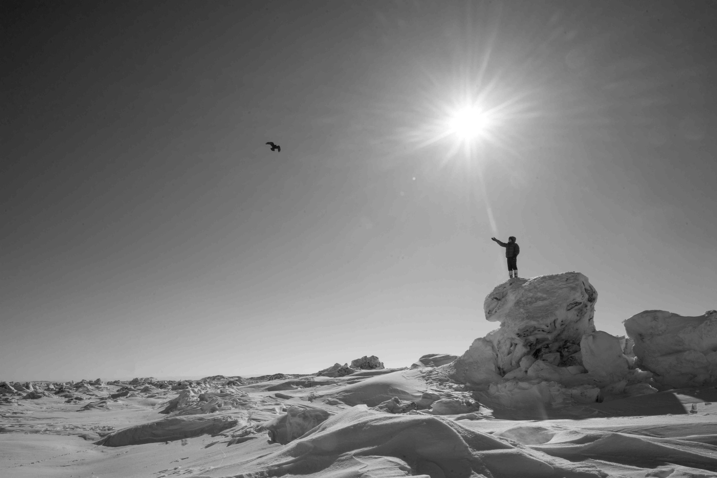 With the second highest tides in the world, Frobisher Bay creates a moonscape backdrop. Photograph by Rae Sirotic.