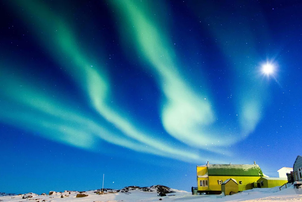 The northern lights are often uncooperative, moving or disappearing as soon as the shot is framed. They take patience and persistence to shoot well.Photograph by Paul Billowes.