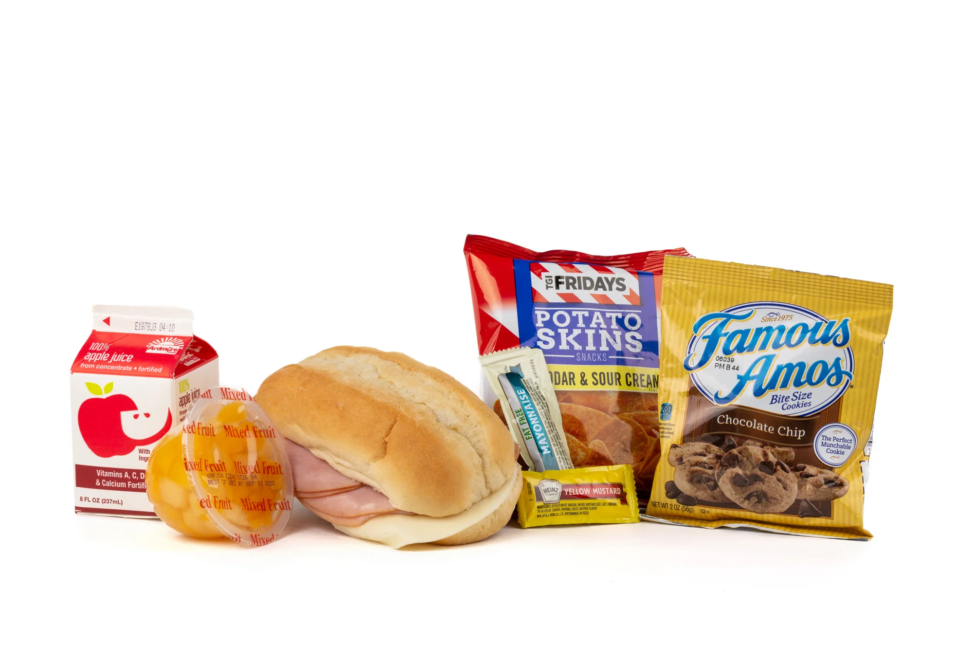 FK01 - Ham/Provolone Sandwich - Frozen NAPA 894001E608177 Sandwich - Ham/Provolone on Sub Bun Frozen Chip Potato TGIF Cheddar Bacon Mixed Fruit Cup Cookie Choc Chip Famous Amos Frozen Apple Juice Mayonnaise Packet Fatfree Dressing Mustard Packet Candy Mint Starlight Spearmint