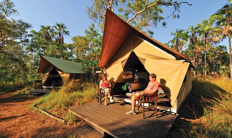 Australia_WA_Kimberley_Mitchell Plateau_Couple sitting outside of tent on deck_APT_Lodge07_LLR.jpg