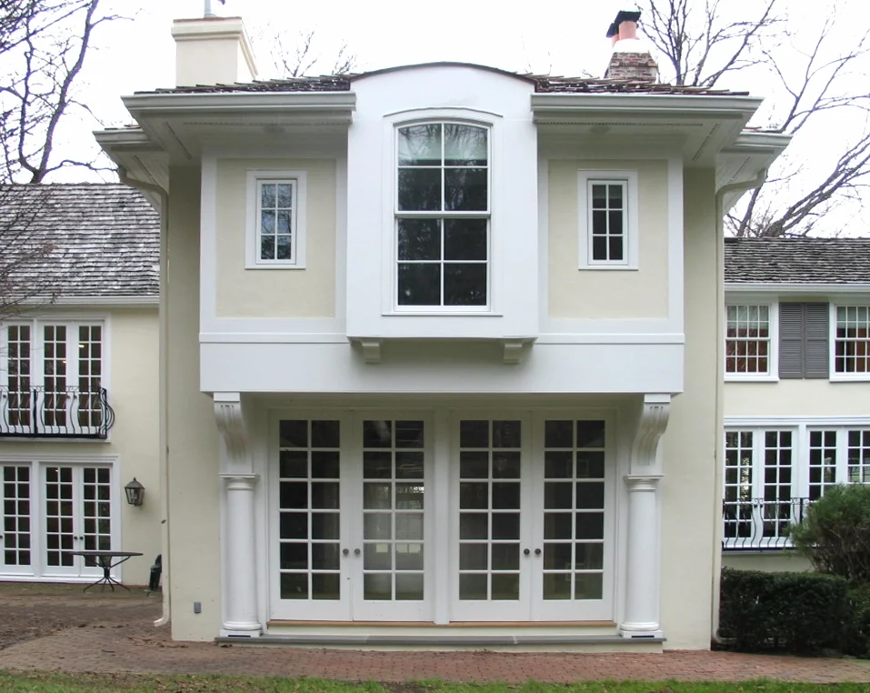  A pair of French doors, which previously led to a solarium, were reused in the rear façade of the addition. 