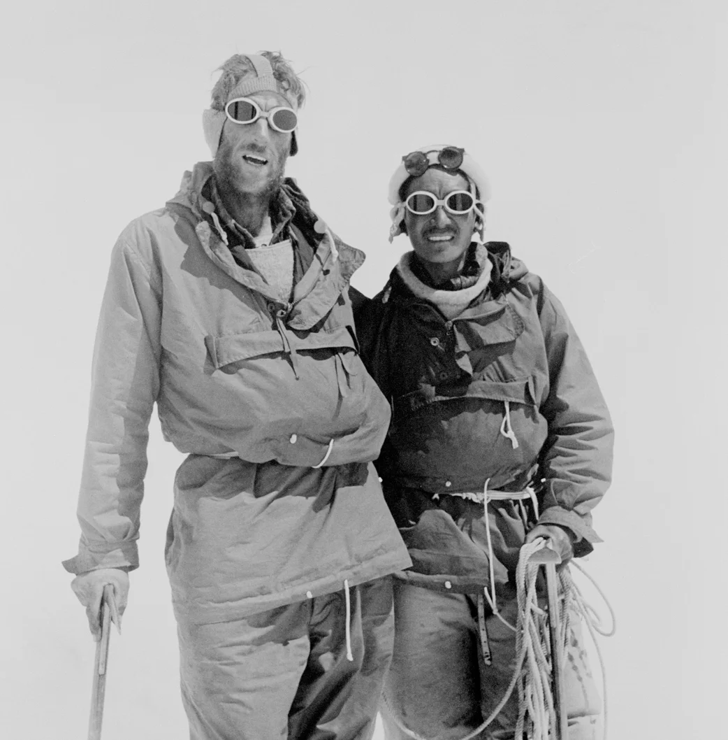 Hillary and Tenzing Norgay at Camp IV after their ascent of Everest. Photograph courtesy of The Royal Geographic Society (with IBG) .
