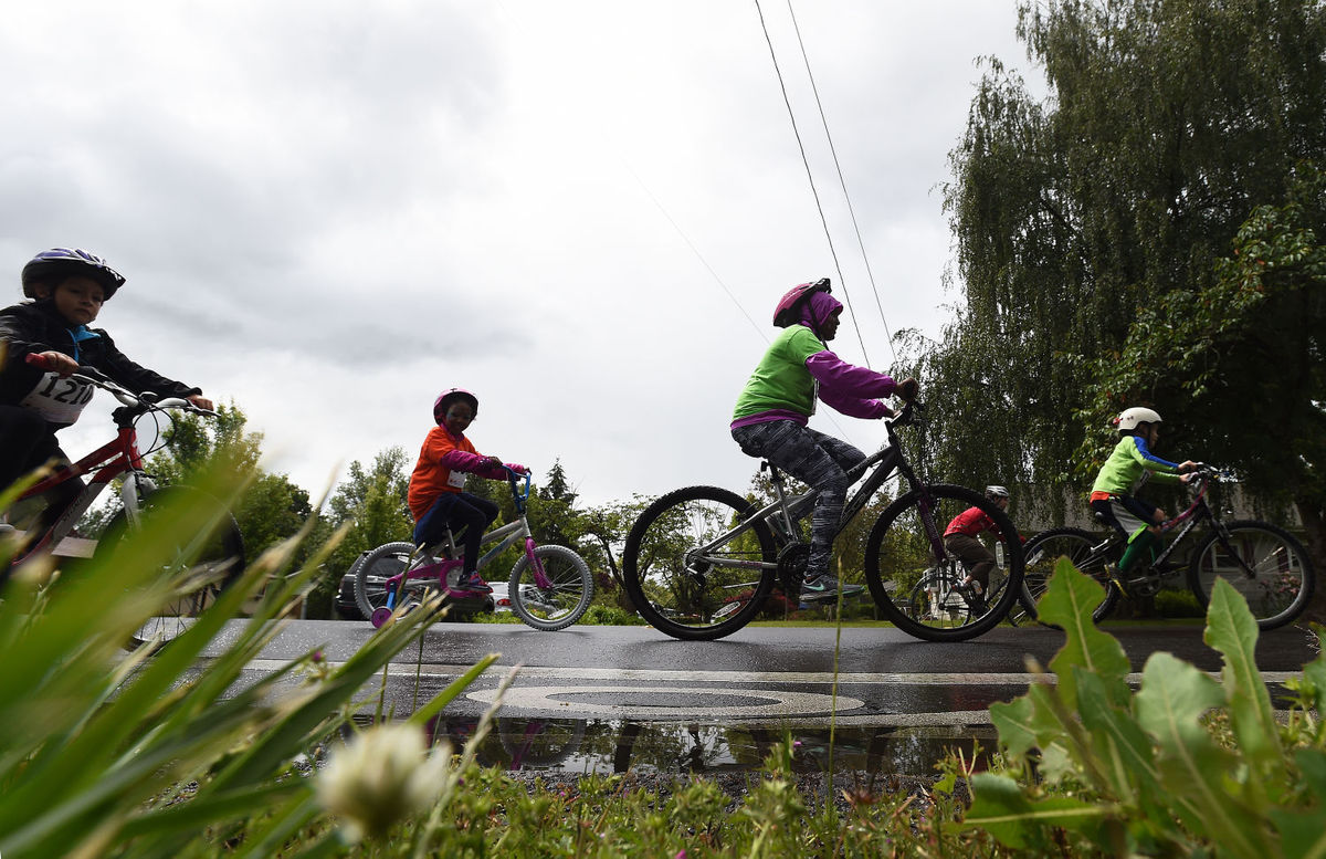 Riders practice safe bicycling habits on the road. Helmets required!