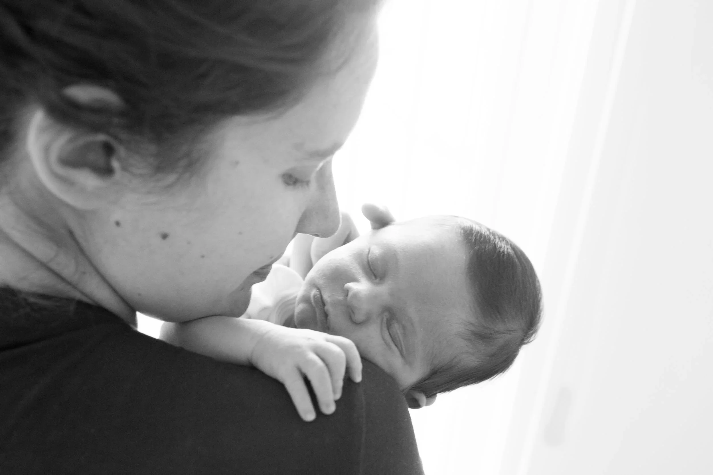 mother and sleeping newborn 