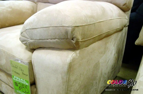 Leather couch with repaired torn arm rest. Repair vs replace with Color Glo.